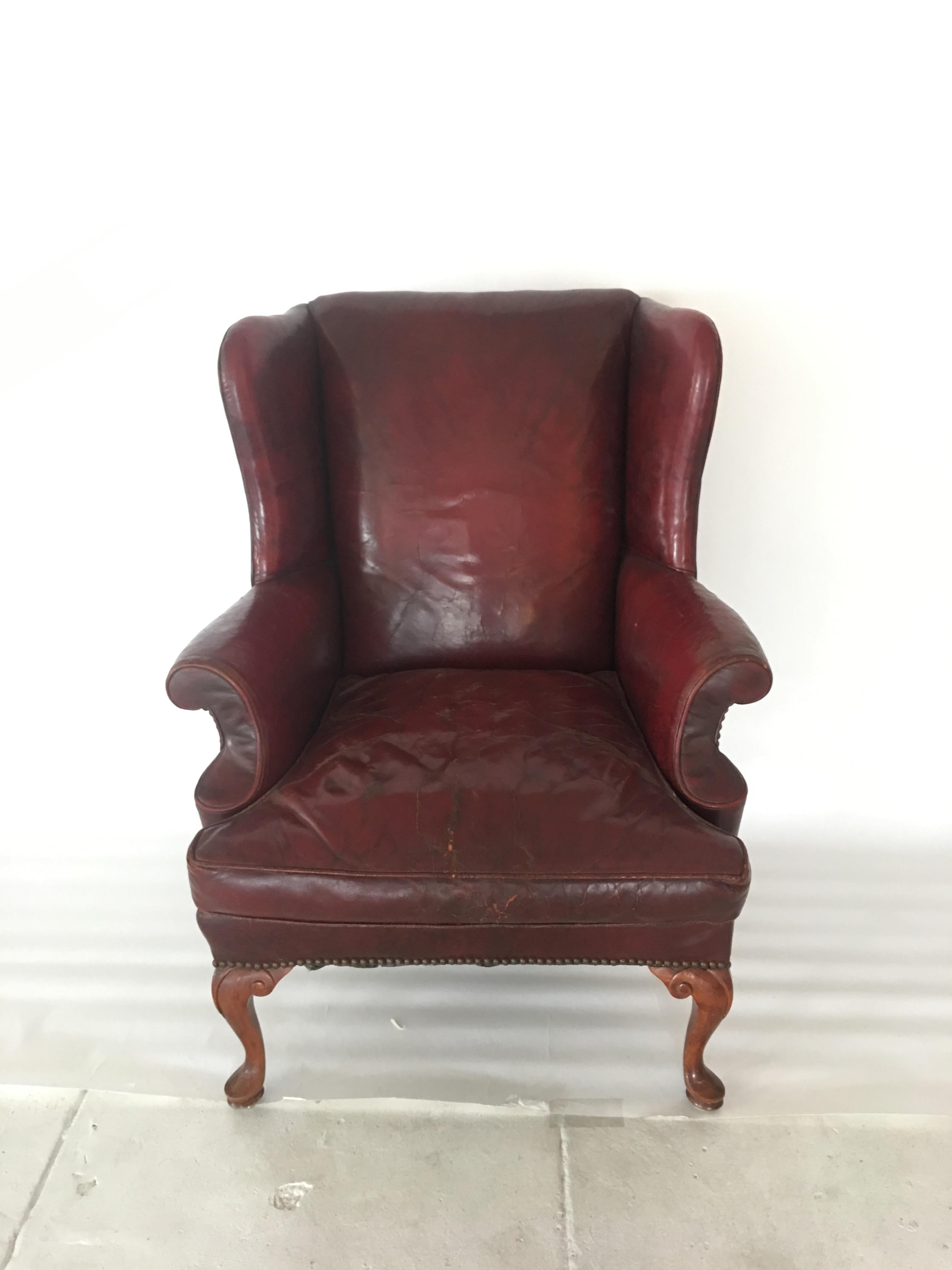 Beautiful Queen Anne Red leather wingback chair. Midcentury, England, circa 1950s.