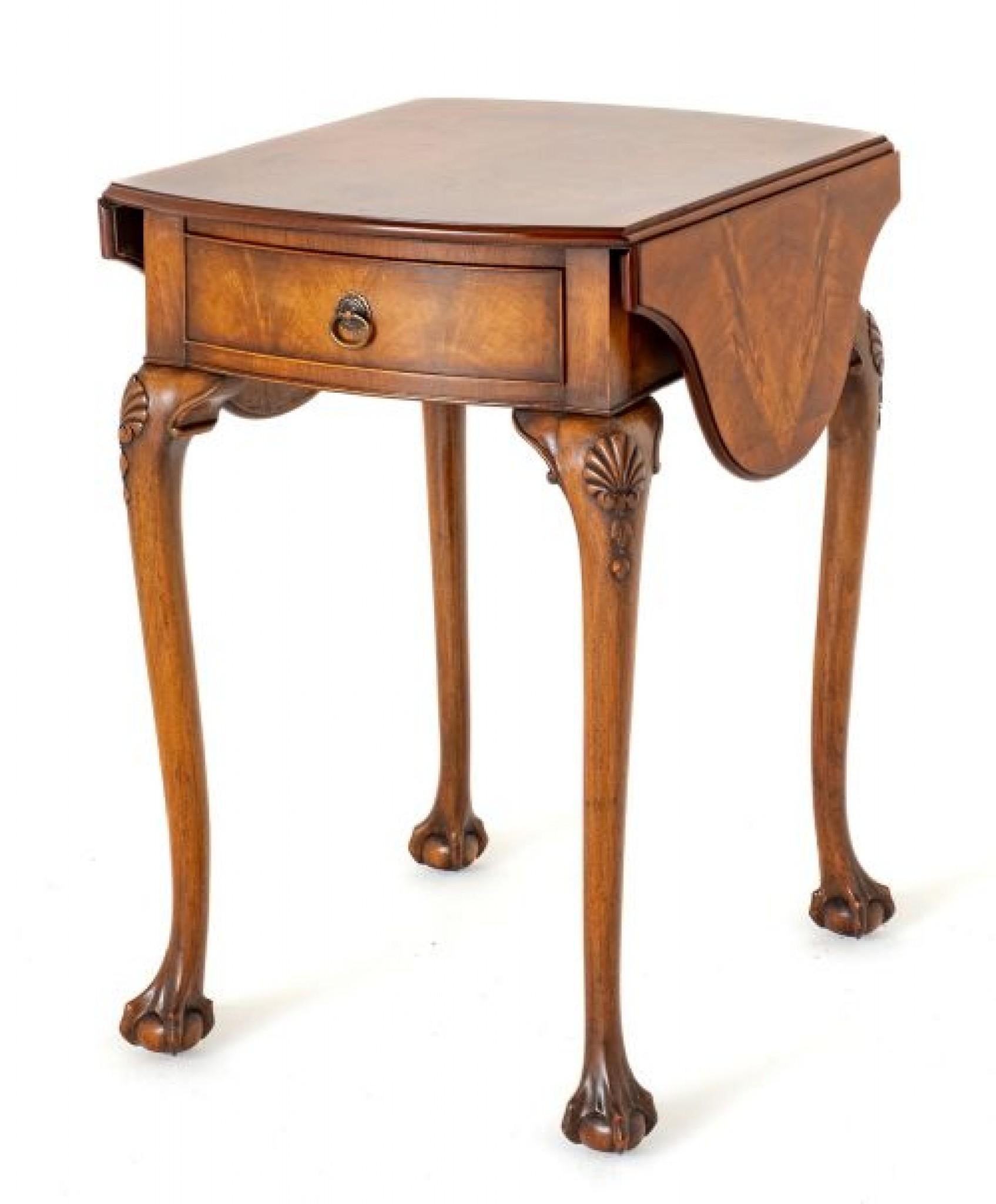 Queen Anne Style Walnut Occasional Table.
This Pretty Table is raised Upon Cabriole Legs with Carved Ball and Claw Feet and Carved Shells to the Knees.
The Table Features 1 x Mahogany Lined Drawer.
Circa 1920
Having Quality Figured Burr Walnut