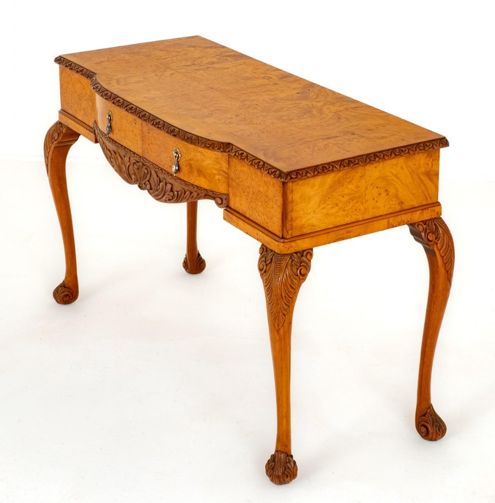 Here we Have a Quality Queen Anne Style Walnut Side Table.
Circa 1930
Raised Upon Cabriole Legs with Carved Knees and Carved Feet.
The Table Features 2 Mahogany and Baize Lined Drawers with a Shaped and Carved Frieze.
The Top of the Table Having