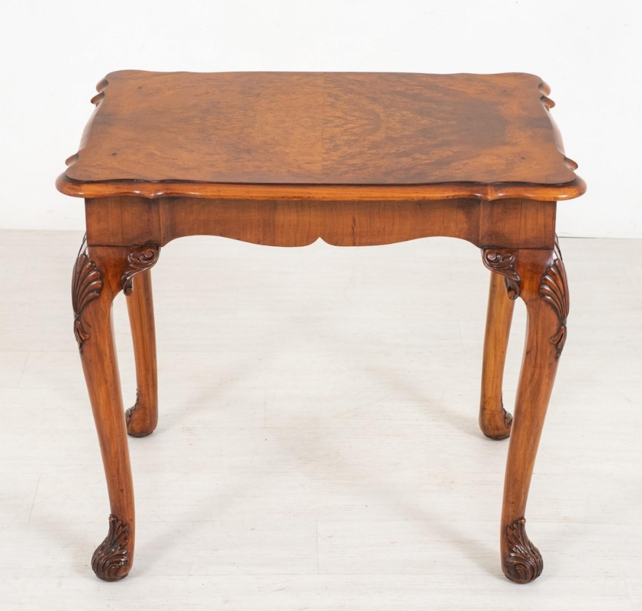 A very good quality walnut queen Anne Style occasional table.
Raised upon Typical Queen Anne shaped legs with carved feet and carved shells to the knees.
The Table Features 1 x mahogany Lined Drawer.
circa 1920
The shaped top of the table having
