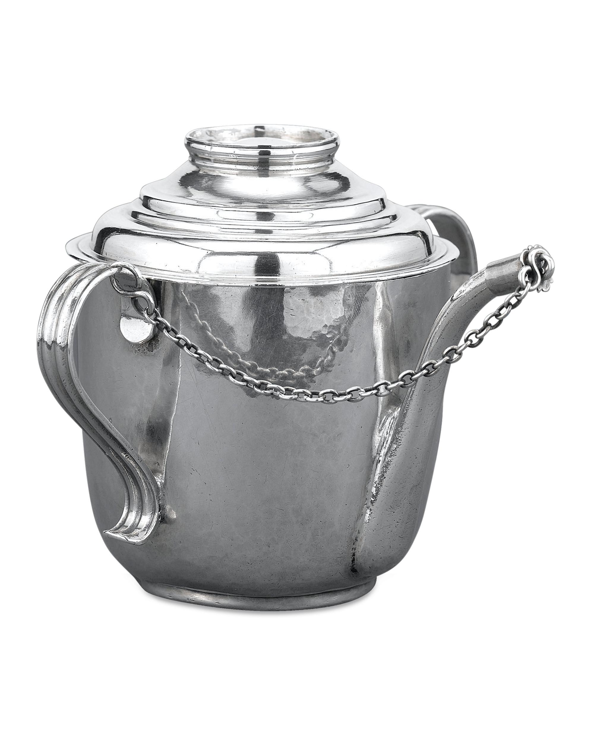 This extremely rare, Queen Anne-period silver feeding cup gives a glimpse into the daily life of 18th-century, England. Crafted by silversmith John East, this subtly designed covered cup would have held broth or thin porridge to nourish a young