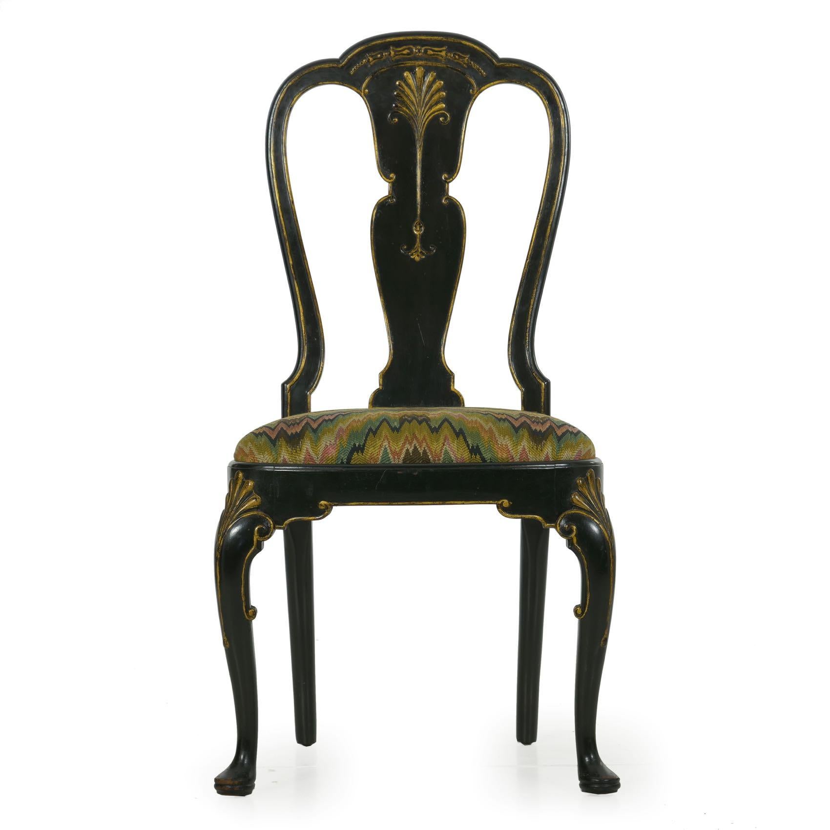 We may have up to four of this chair available in the shop, each being sold individually. A rather superb chair of fine craftsmanship, it is finished in a black lacquer with bas-relief gilded motifs throughout. The crest rail is beautifully