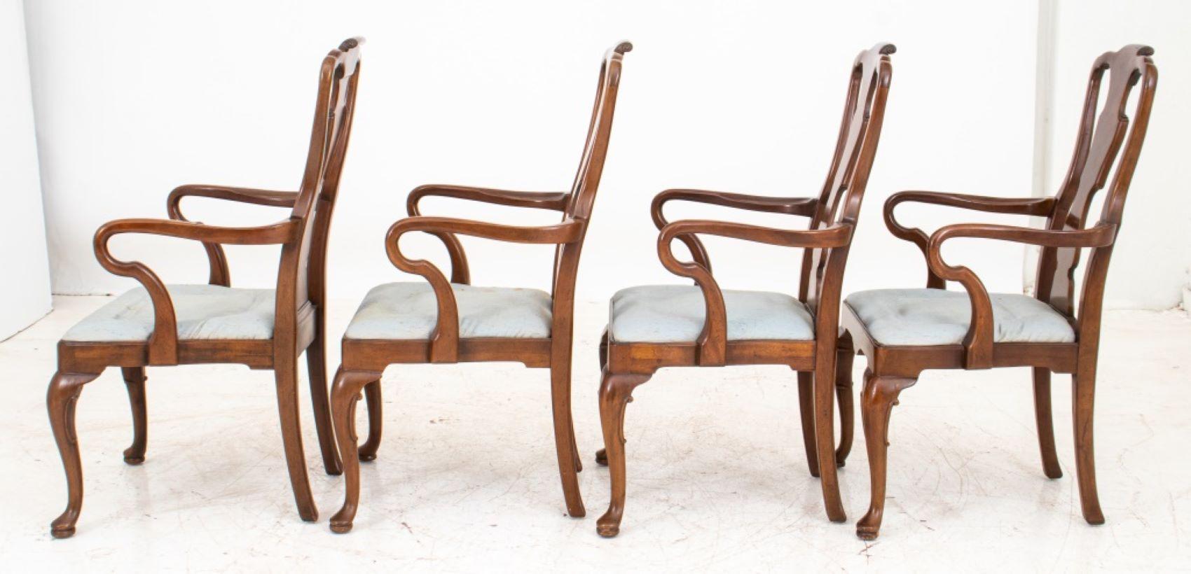Queen Anne style arm chairs, four (4), each with shaped scrolling crest rail and vasiform scrolling back splat above a shaped drop-in seat and conforming seat rail on cabriole legs terminating in pad feet.  40