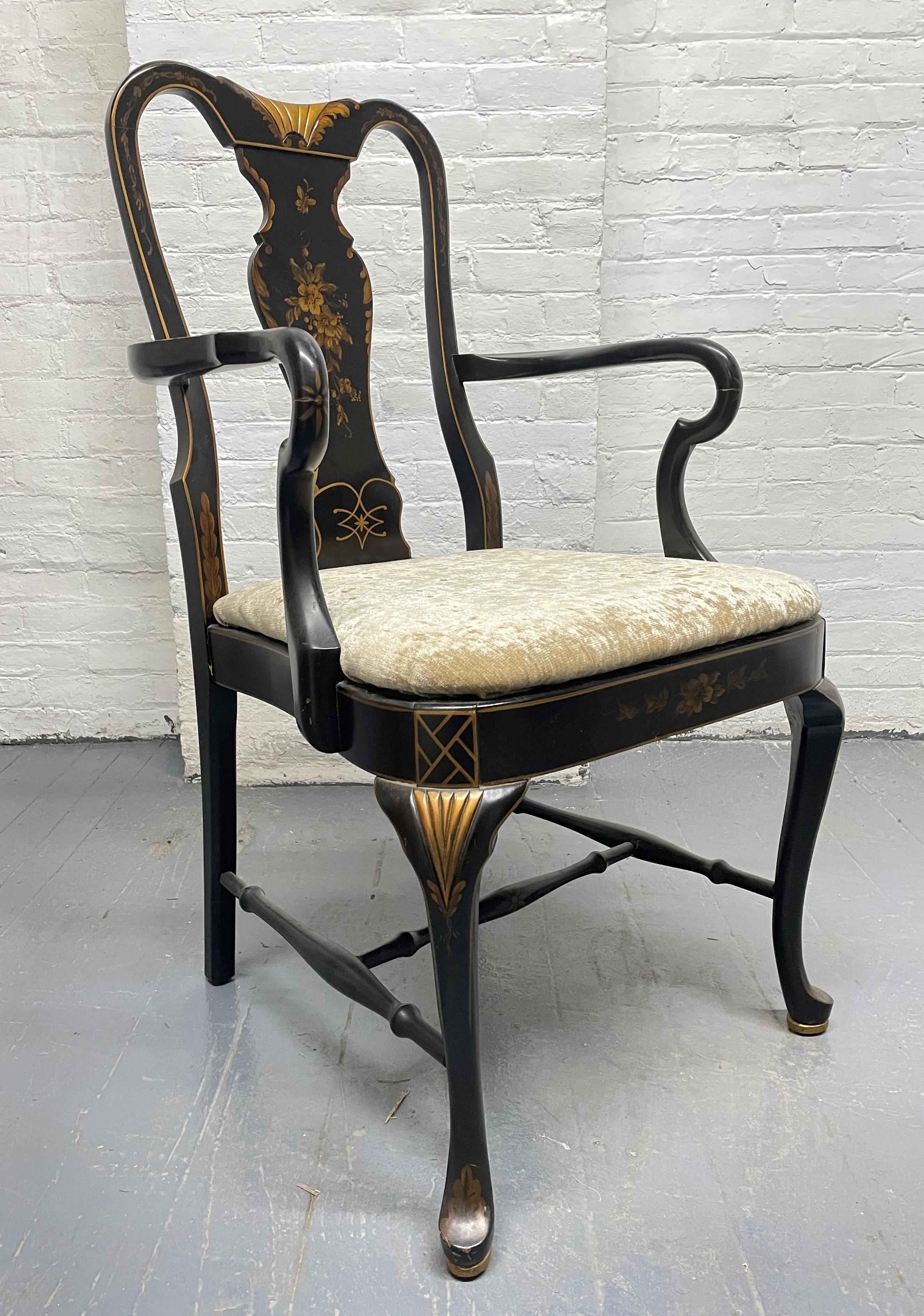 Queen Anne style armchair. The chair has a black lacquered frame, a velvet seat with a stenciled back.