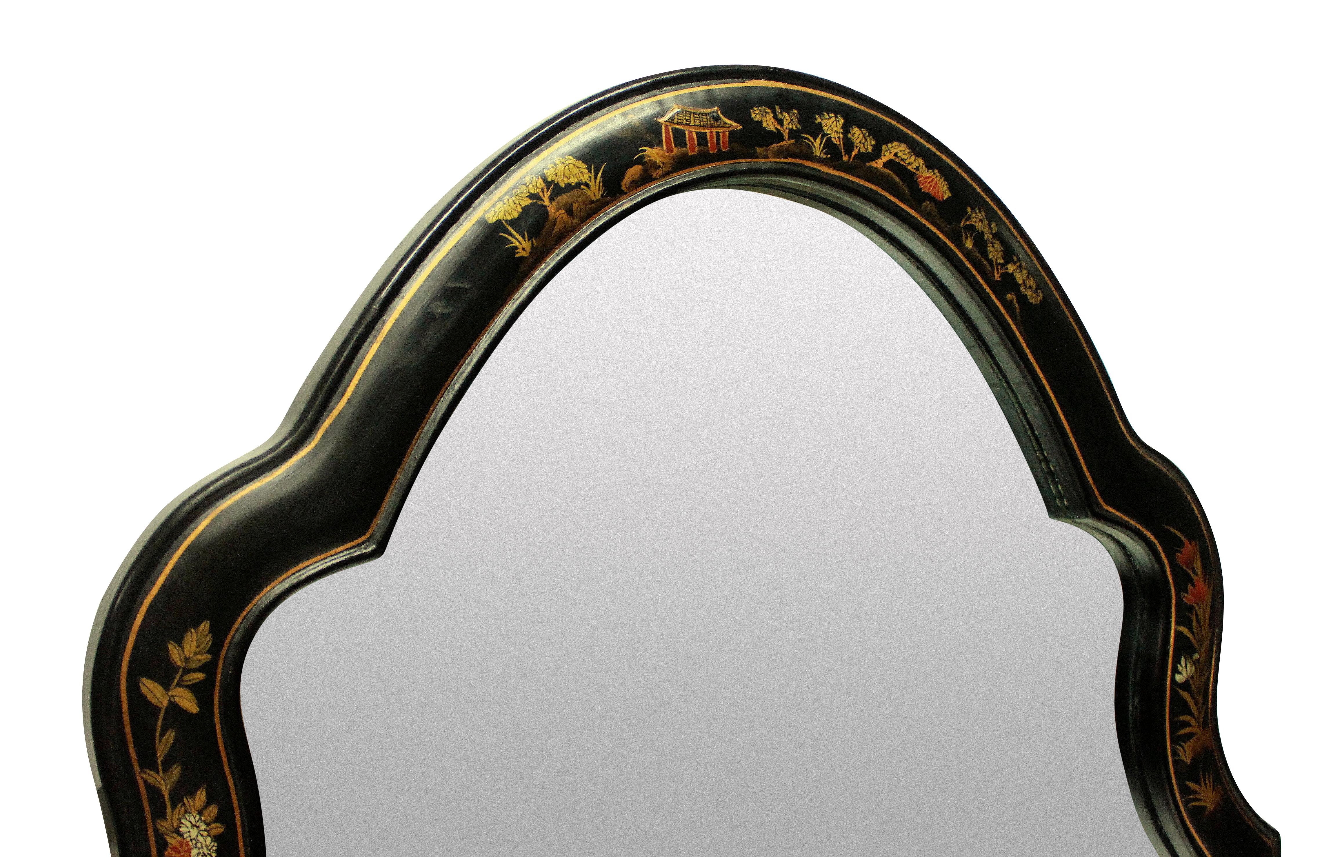 An English Queen Anne style Japanned mirror in black lacquer with gold decoration.