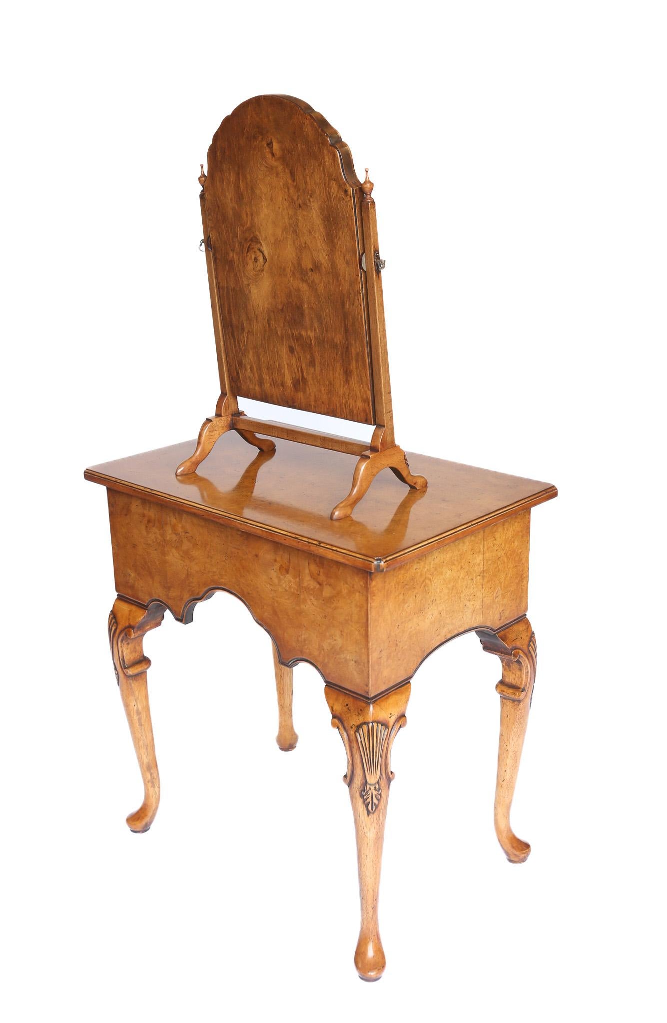 Queen Anne style  Burr Walnut  small dressing table circa 1930s
Walnut Framed Arch top swing dressing mirror, Brass pinch screws
Pair Square Column Supports, with turned finials, 
Walnut Cross stretcher , supporting
4 Small cab legs with shell