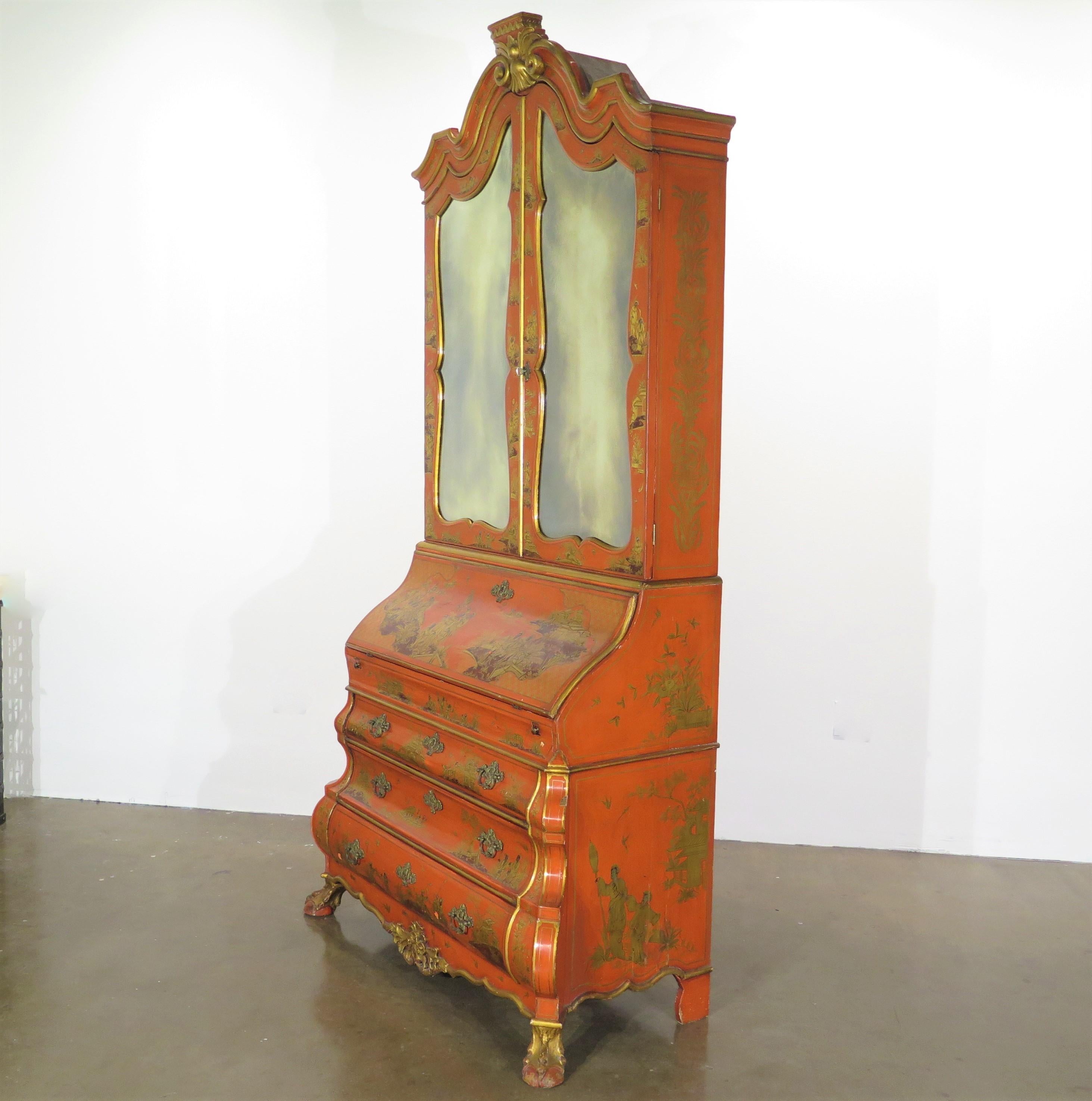 a Queen Anne-style Chinese red (vermillion) chinoiserie secretary / desk and bookcase with all over gilt decoration, a drop-front desk / writing surface, a scroll bonnet top / pediment, raised on 