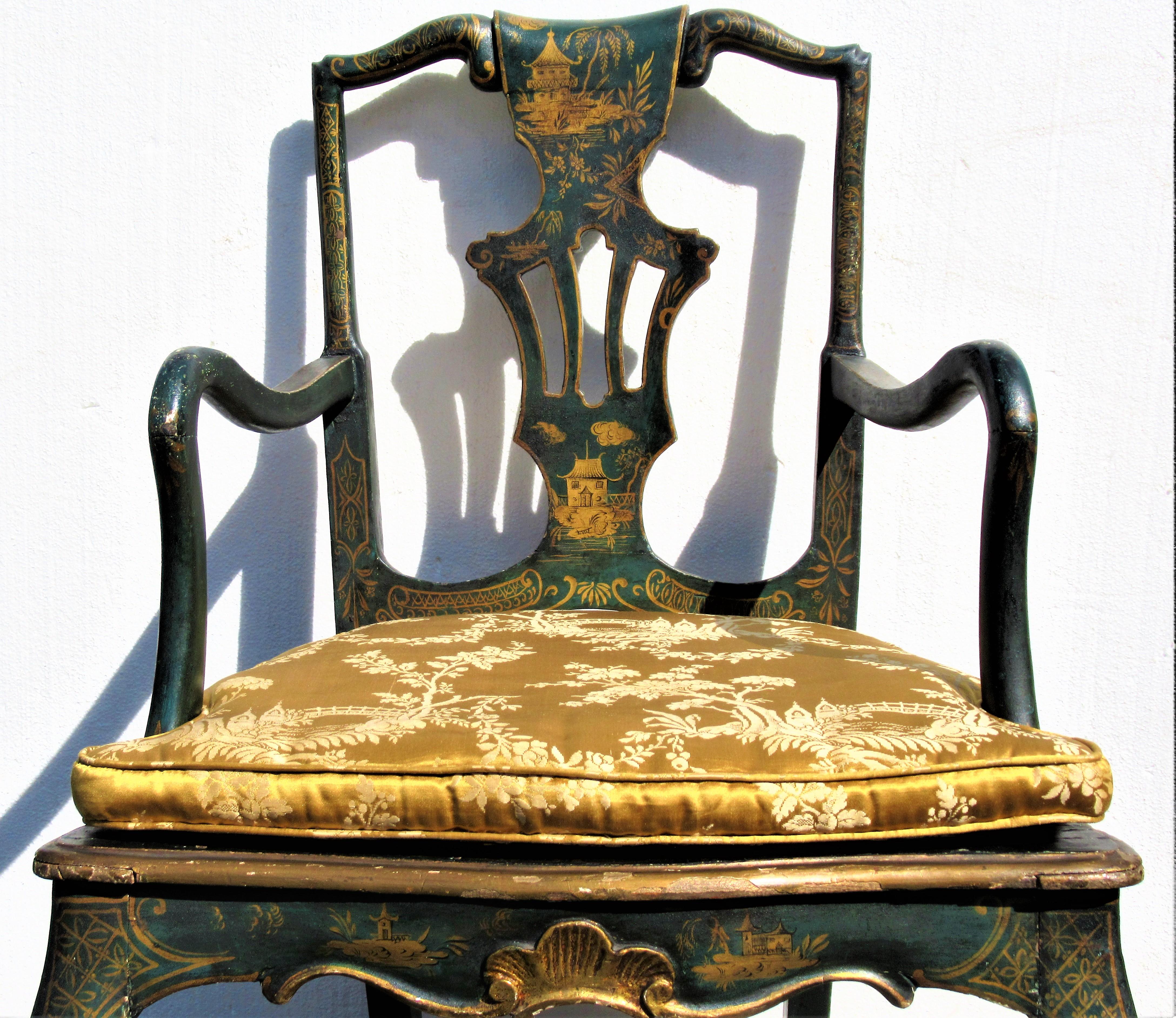 Antique Queen Ann style dark green japanned chinoiserie armchair with a beautifully carved sculptural quality and very fine all over gilded decoration. Most likely English in origin. Late 19th. century. Look at all pictures and read condition report