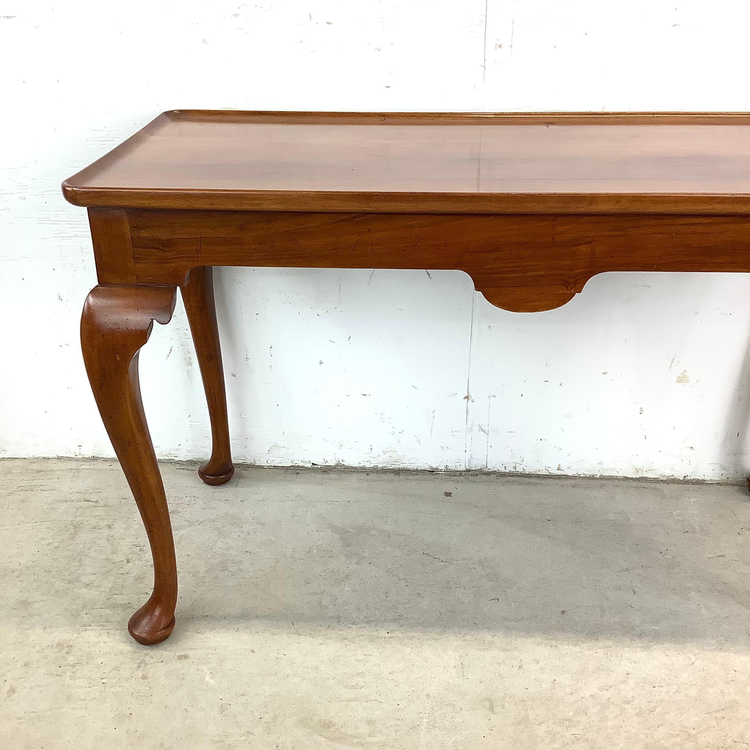 With its graceful Queen Anne curves, rich cherry wood finish, and versatile design, this console table is a stunning nod to classic French Provincial craftsmanship. Designed in the style of Ethan Allen, it balances ornate elegance with everyday