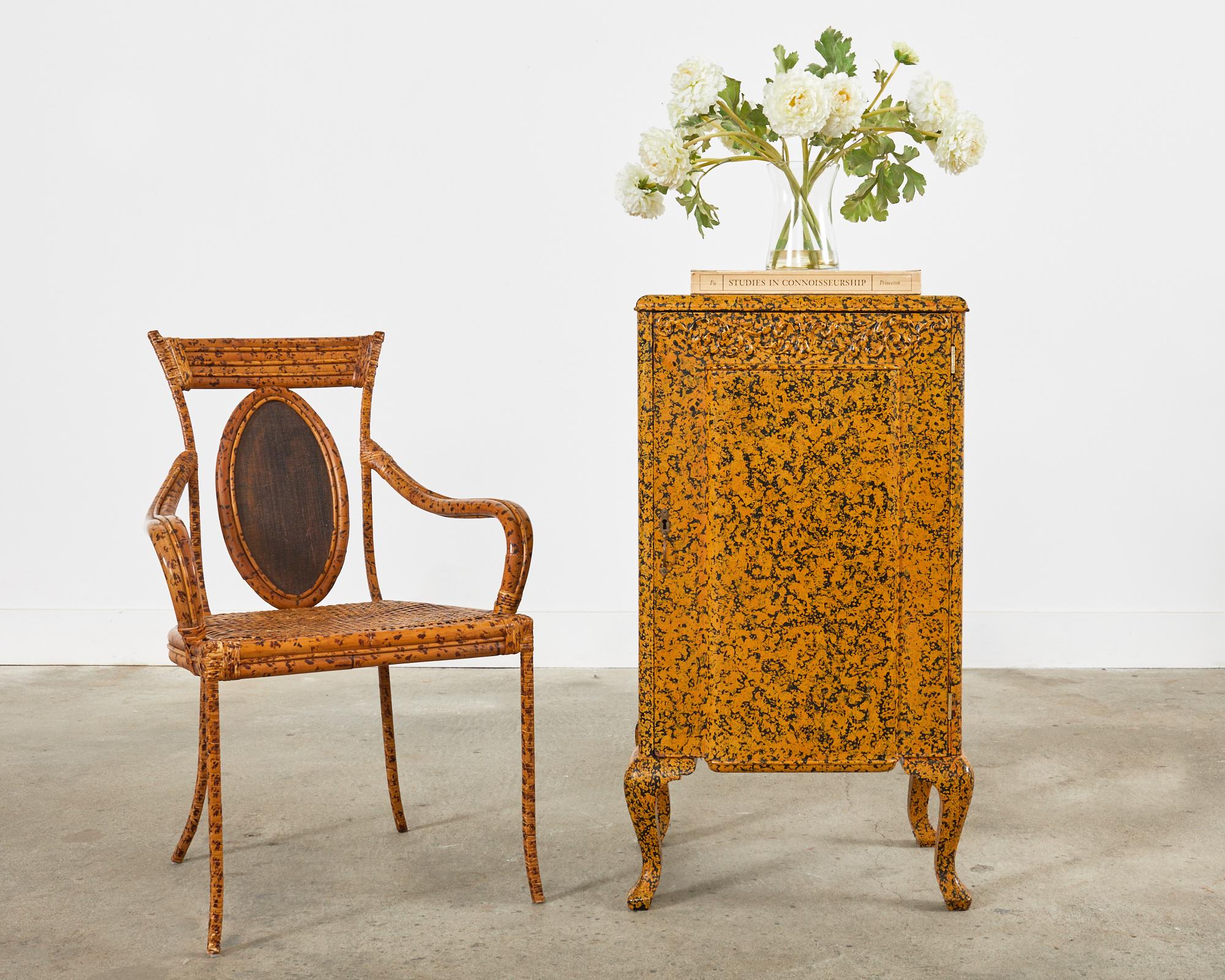Charming 19th century mahogany cabinet or cupboard featuring a mustard yellow lacquer speckled finish by artist Ira Yeager (American 1938-2022). The cabinet is fronted by a large door with a small patinated brass pull. The door is decorated with