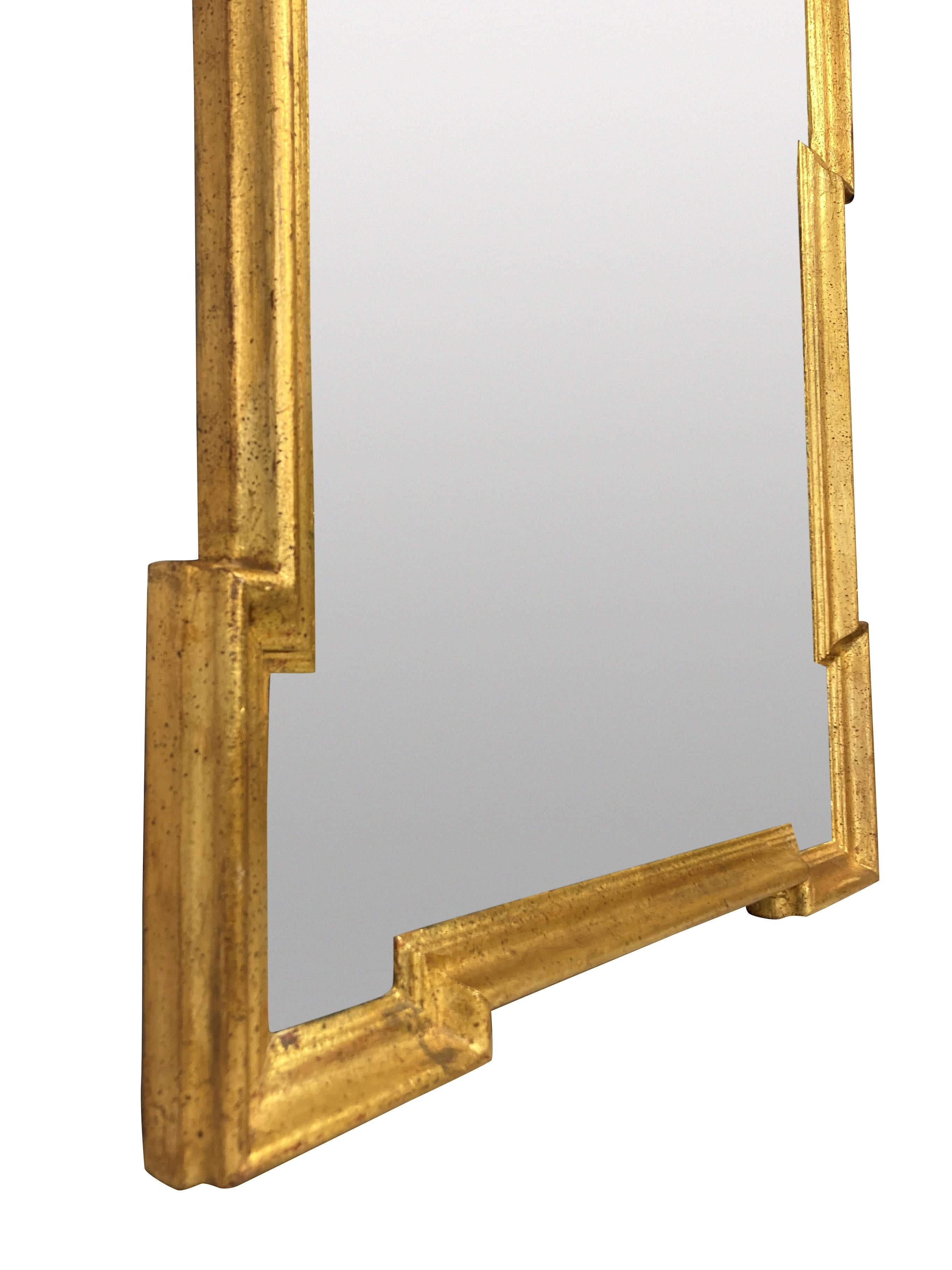 An English mid-century Queen Anne tyle gilt wood mirror.