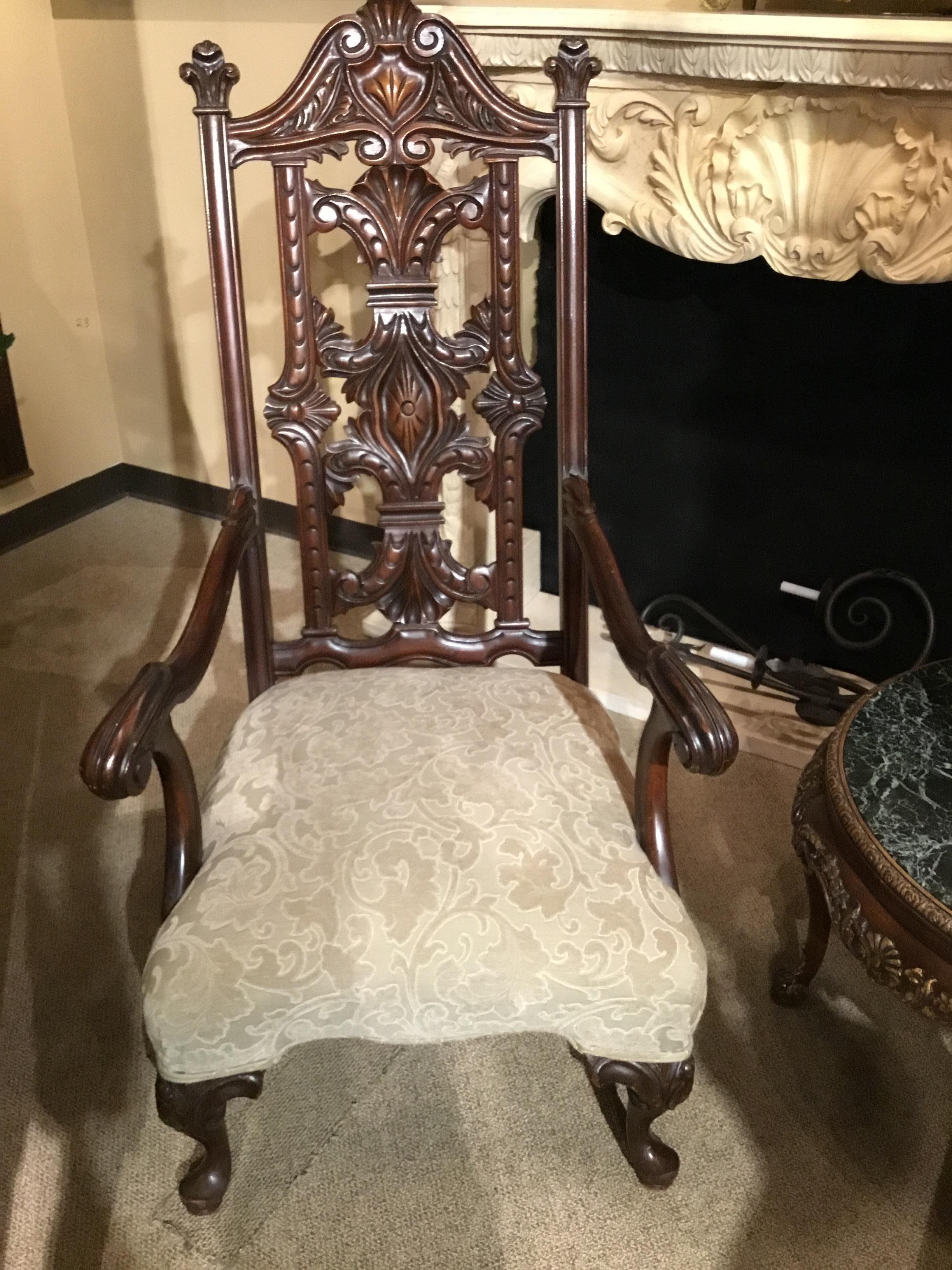 Exceptional carving with intricate open pierced carving on the back of
This chair. Gracefull curved arms that curl at the ends.
New cream upholstery make this Piece especially desirable.
The legs are in the Queen Anne style.
