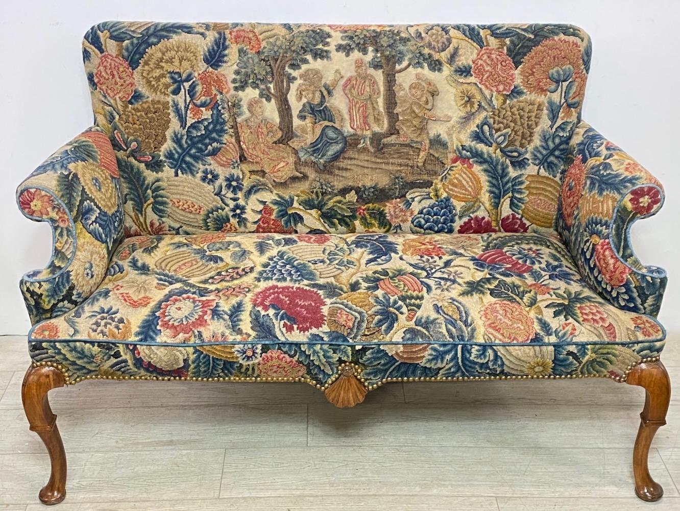 A exceptional late 17th / early 18th century English Queen Anne  mahogany settee with period needlepoint and velvet upholstery. 
Frame is sturdy and structurally sound, and needlepoint tapestry is in very good antique condition. There are some old