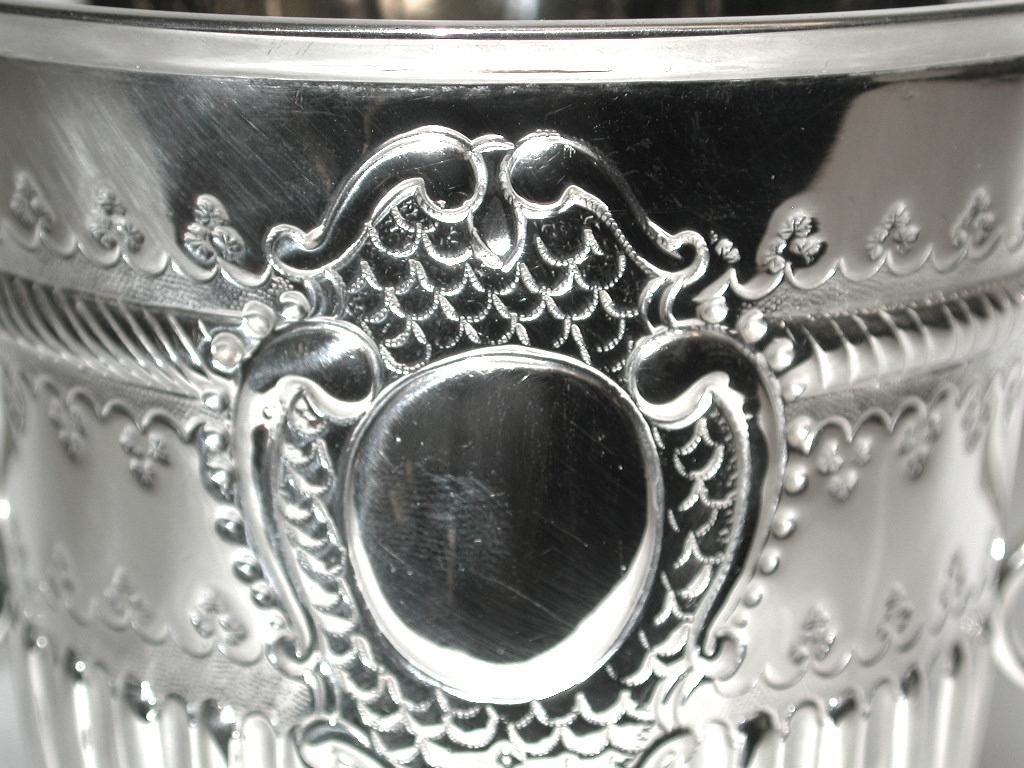 Heavy gauge silver porringer made in London by the Pairpoint Brothers.
This firm made handwrought silver at the turn of the 20th century and
specialized in reproducing period silver.
This lovely piece of silver was originally retailed by Jay's of