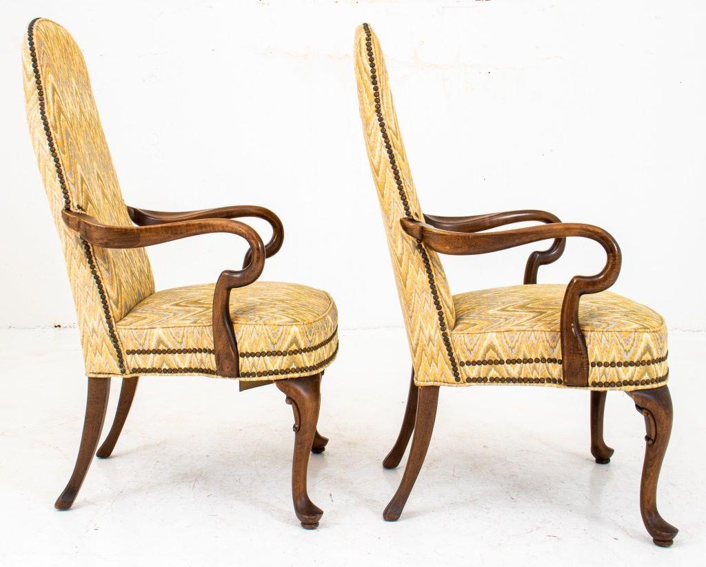 Queen Anne style upholstered open arm chairs, two, each with shaped flame-stitch bargello-pattern fabric nailed and upholstered back and seats, on cabriole legs ending in pad feet. 

Dimensions: 43