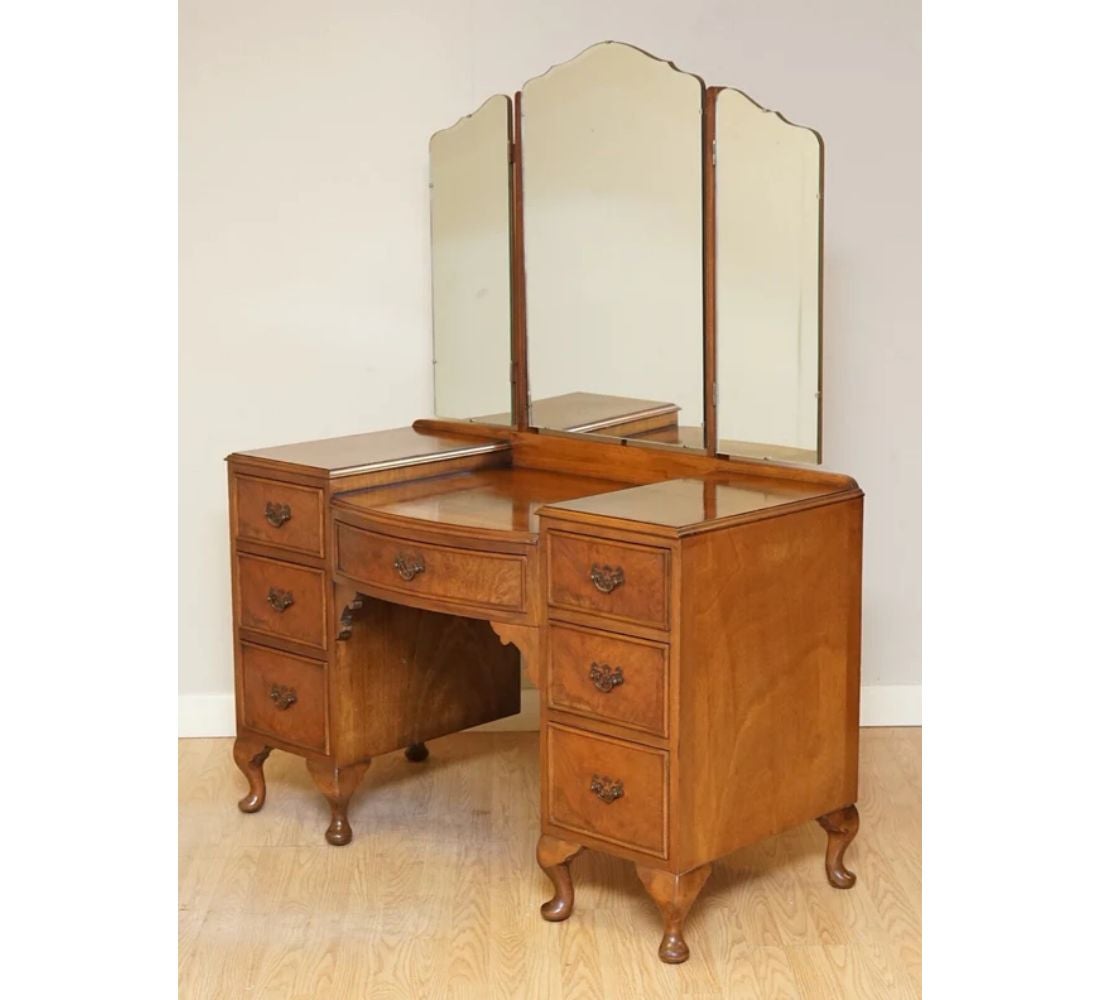 We are delighted to offer for sale this lovely vintage burr walnut dressing table and stool with cabriolet feet.

A well-made and solid table with gorgeous burr around, We have had the stool reupholstered, and for the rest, we have lightly