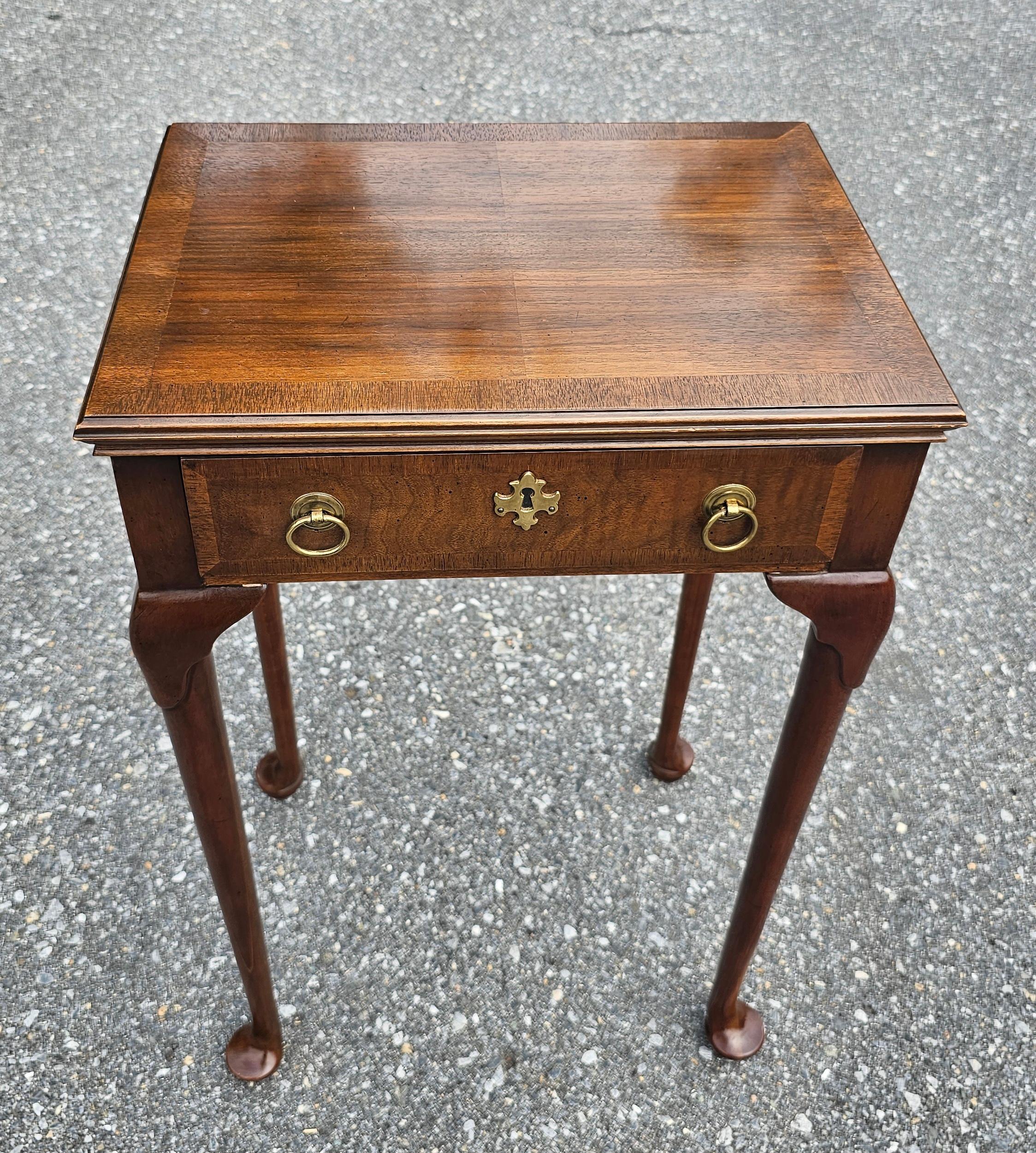 A slender Queen Anne Style Walnut high side Table in great vintage condition. Featire a single drawer with dovetail joins and with two pulls. Measure 16.75