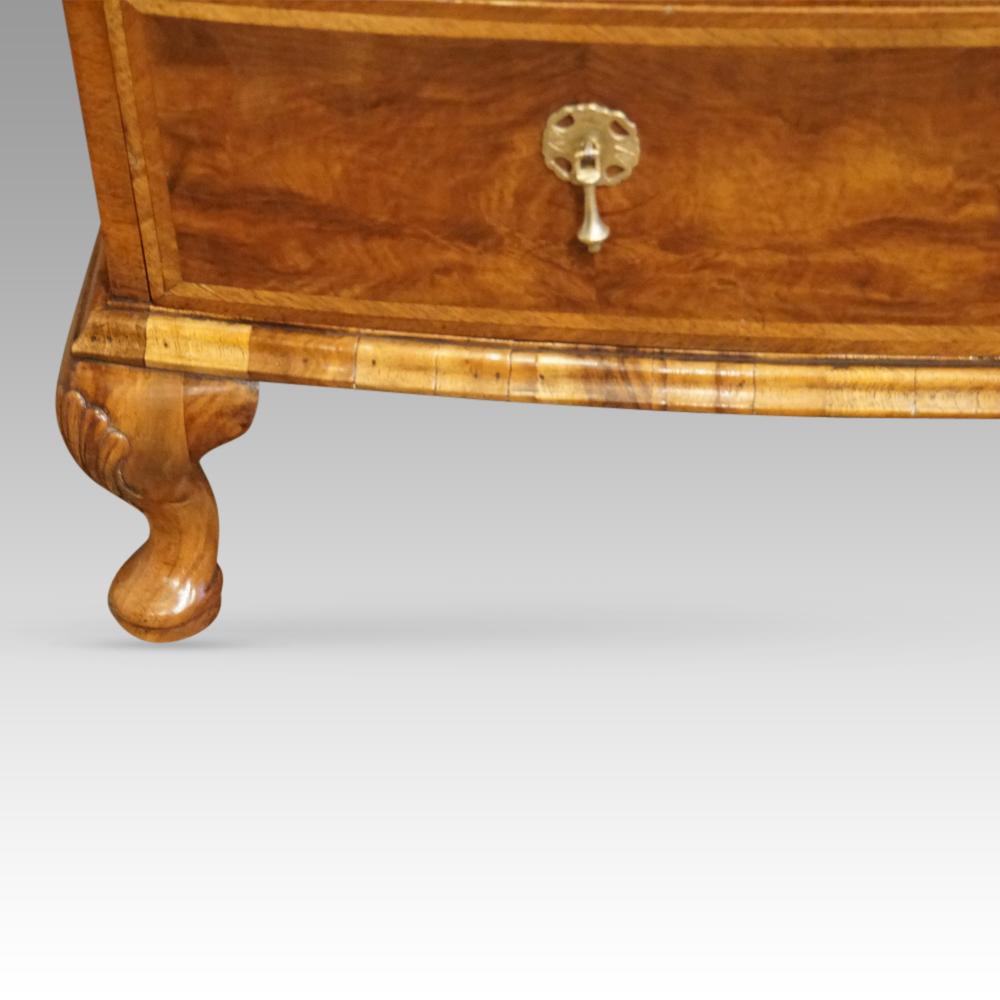 Queen Anne style walnut bow chest 
This Queen Anne style walnut bow chest was made circa 1910.
It is bow fronted and fitted with an unusual drawer formation of 3 small drawers along the top and then a standard drawer formation of 2 small and 2 full