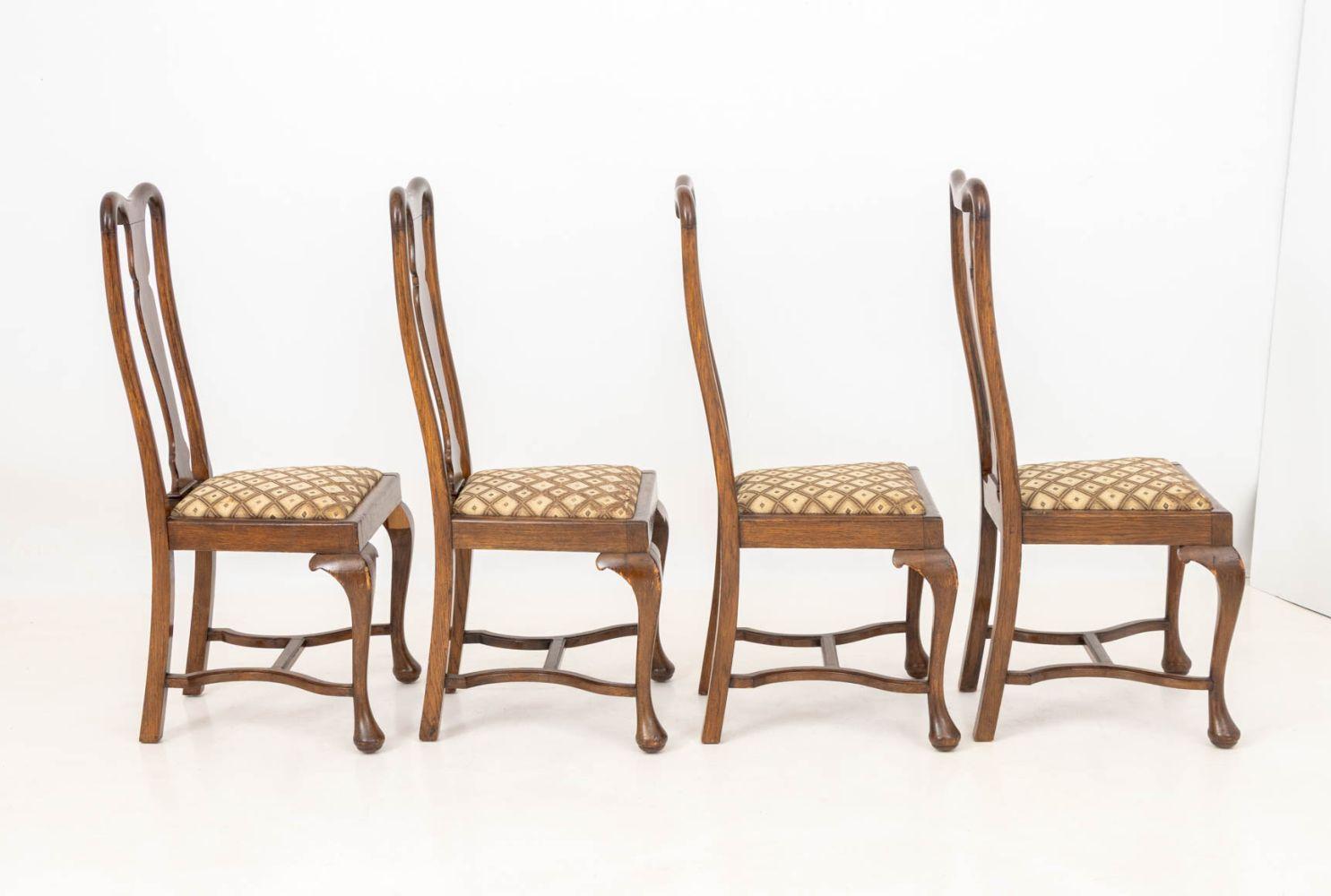 Set of Eight Queen Anne Style Walnut Dining Chairs, with fabric upholstered seats atop cabriole legs.

42.5