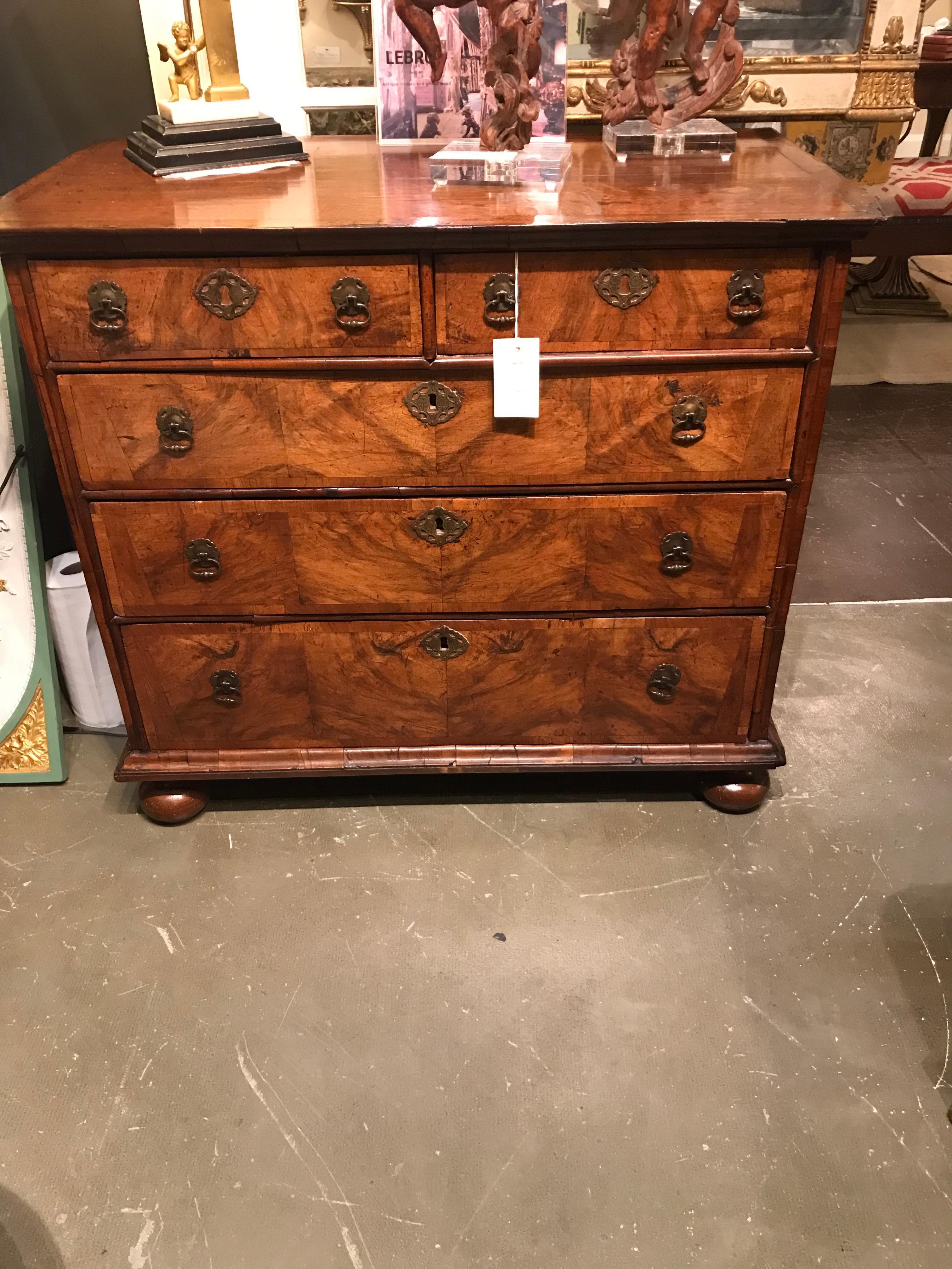 With original hardware and oak top. Presents extremely well for all the hard living of three centuries since that period .The sides are of solid boards ( with warm and rich color & patina ) the drawer fronts with finely figured slightly faded walnut