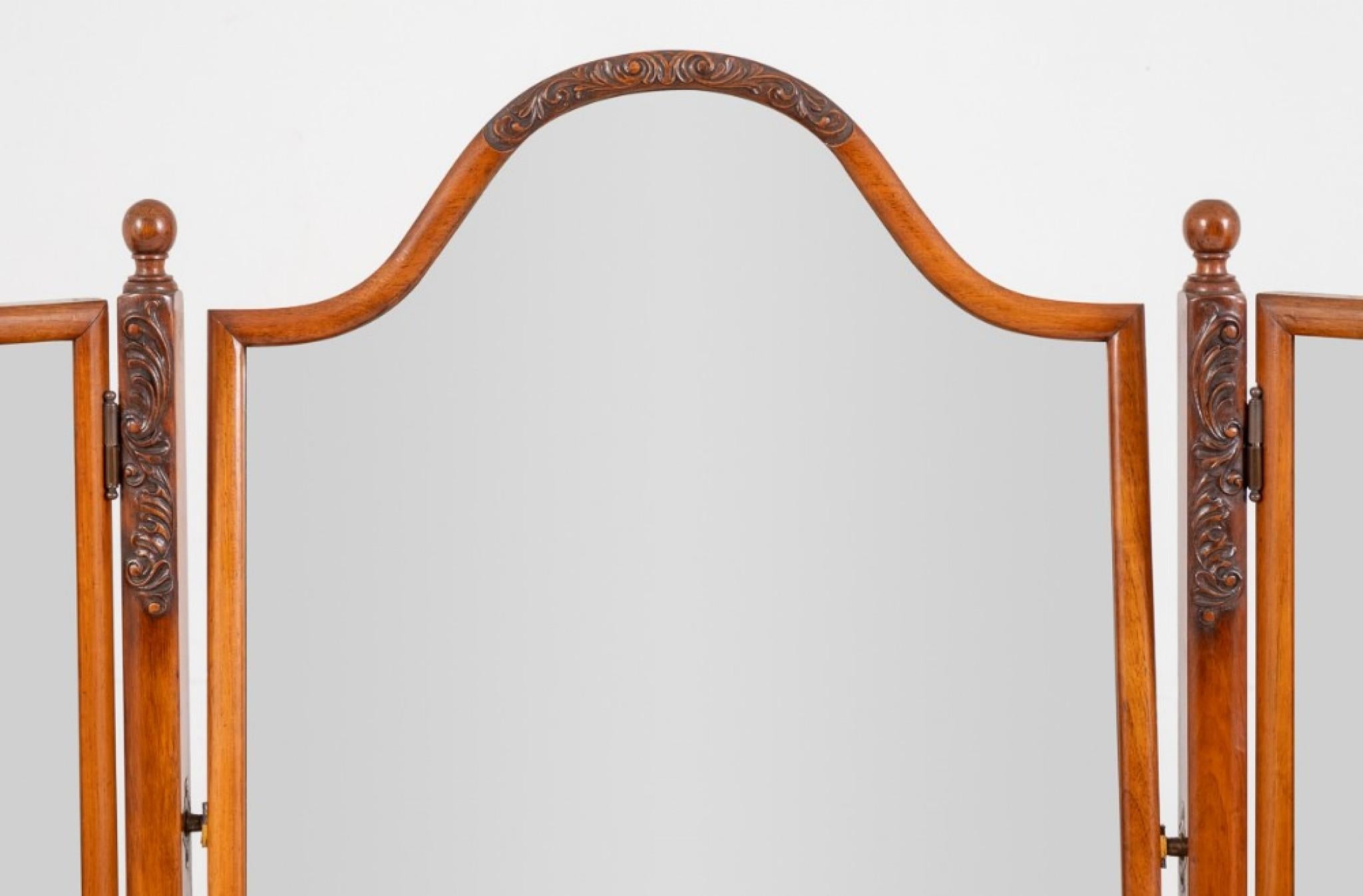 A very nice quality queen Anne style walnut triple mirror.
Standing upon carved lions paw feet with carved knees.
circa 1920
The adjustable wing mirrors and uprights feature carved detail and turned finials.
Very good quality and in very good