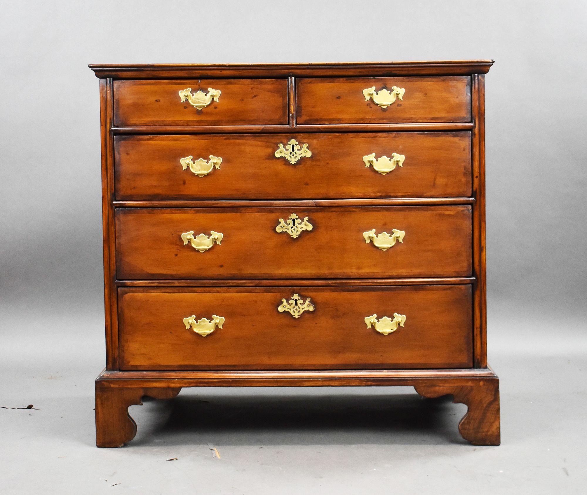 A fine early 18th-century Queen Anne chest of drawers crafted from rich English walnut with exceptional warmth and depth of tone. This elegant piece features a classic two-over-three drawer configuration, adorned with period-style brass bail handles