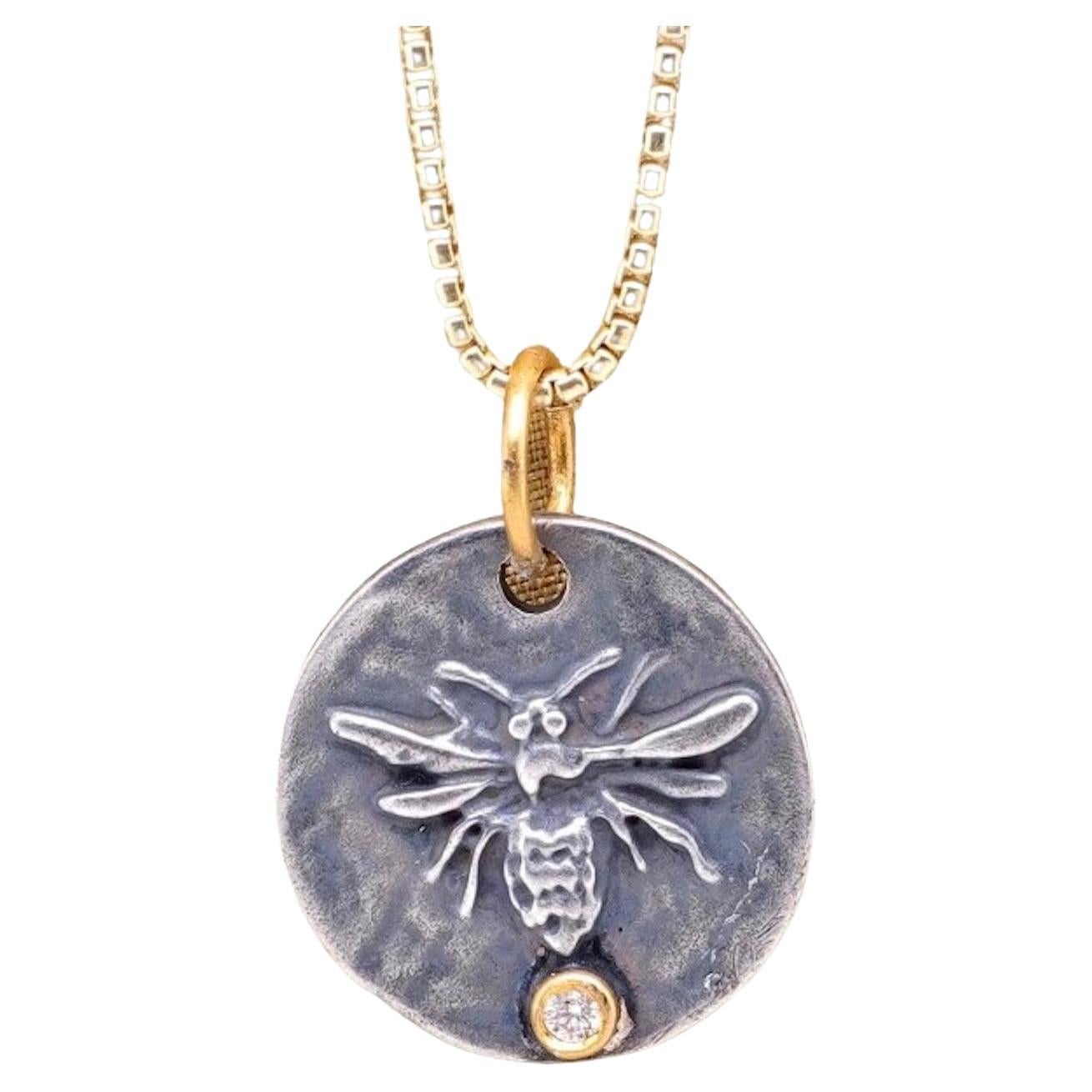 Queen Bee, Pendant Necklace Charm Coin Amulet with Diamond, 24kt Gold and Silver by Prehistoric Works of Istanbul, Turkey. Diamond - 0.02cts. These coin amulets pair well alone or with other coin pendants or with miniature pendants. Measures 17mm x