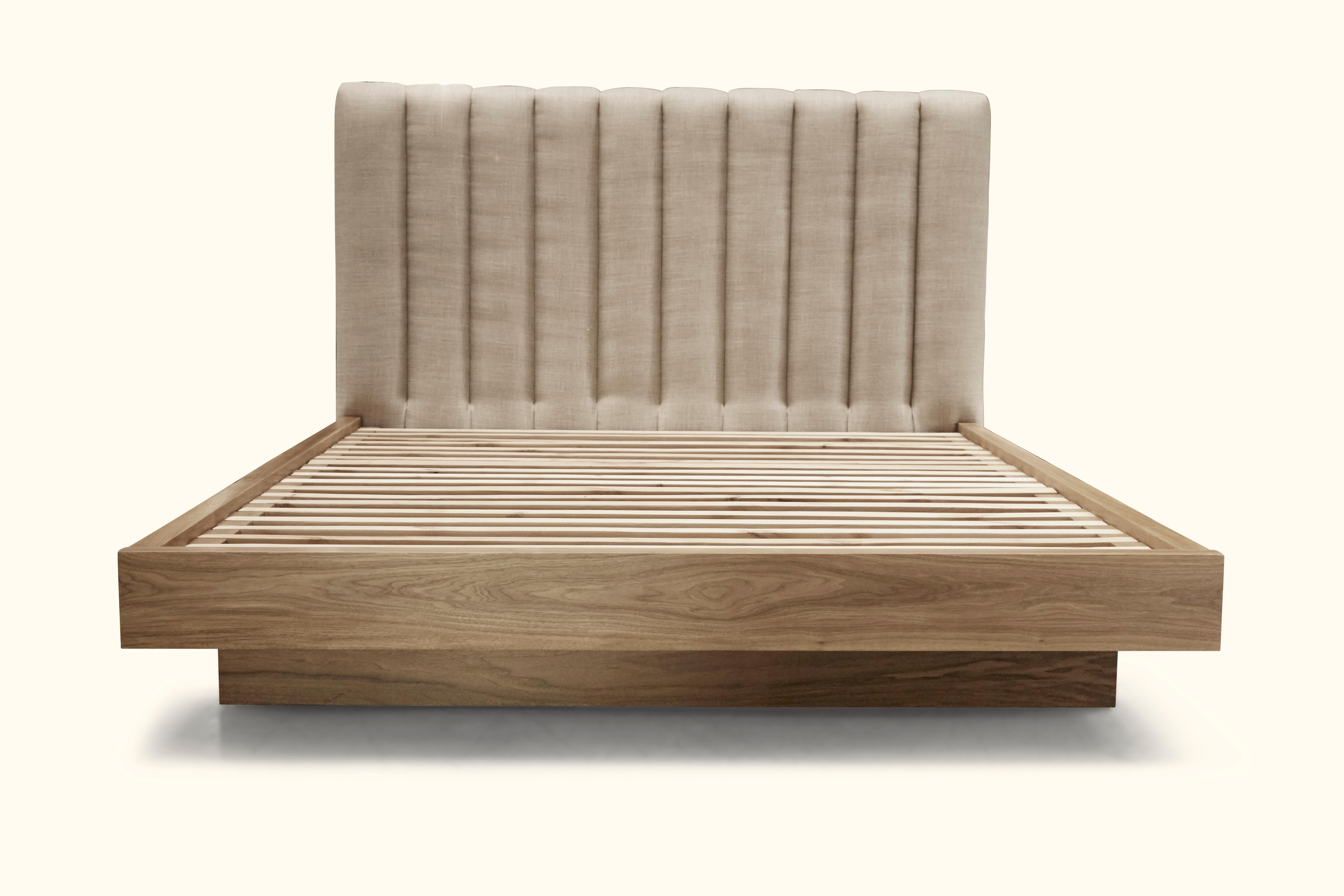 The Capitan bed features a channel tufted headboard and a minimal, Japanese-inspired wood platform. Available in American walnut or white oak. Shown here in linen and natural walnut. Queen size.

The Lawson-Fenning Collection is designed and