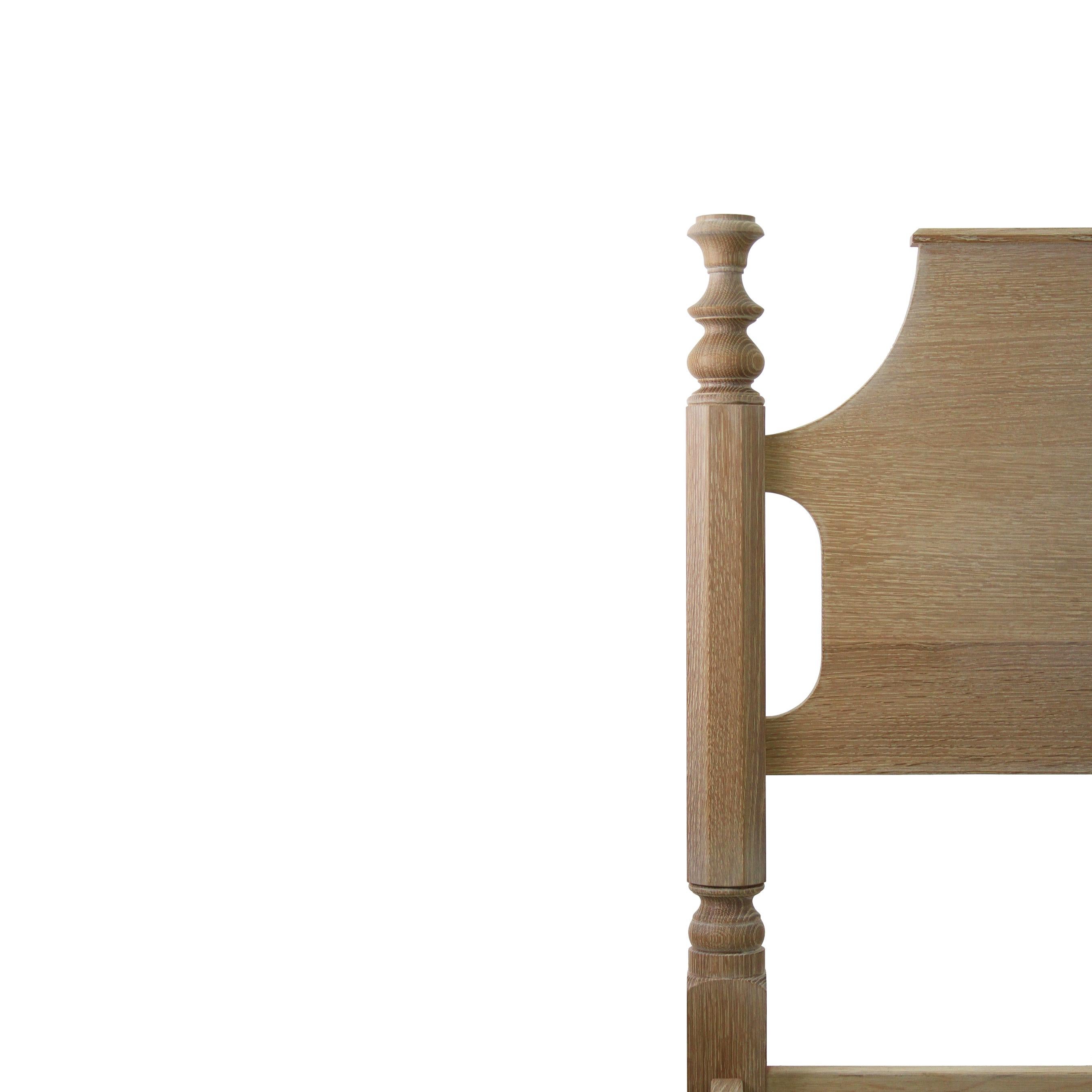 The tulip top bed is one of our most popular, with a contiguous headboard and post height this bed is perfect for a smaller scale room. Featuring a capped flat headboard with a molded trim adding subtle detail. Shown in whitewashed white oak, it is