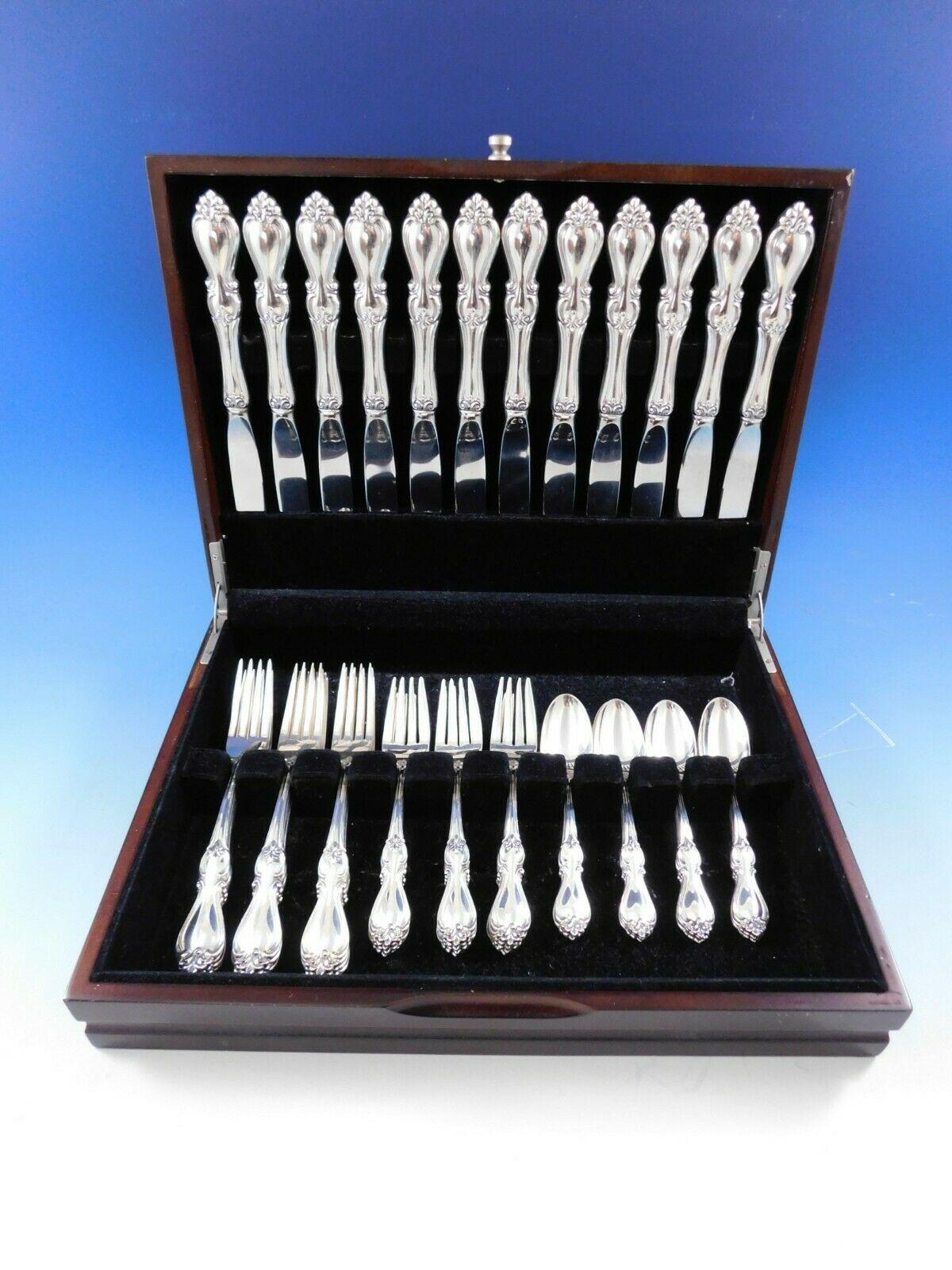 Dinner size Queen Elizabeth I by Towle sterling silver flatware set, 48 pieces. This set includes:

12 dinner size knives, 9 5/8