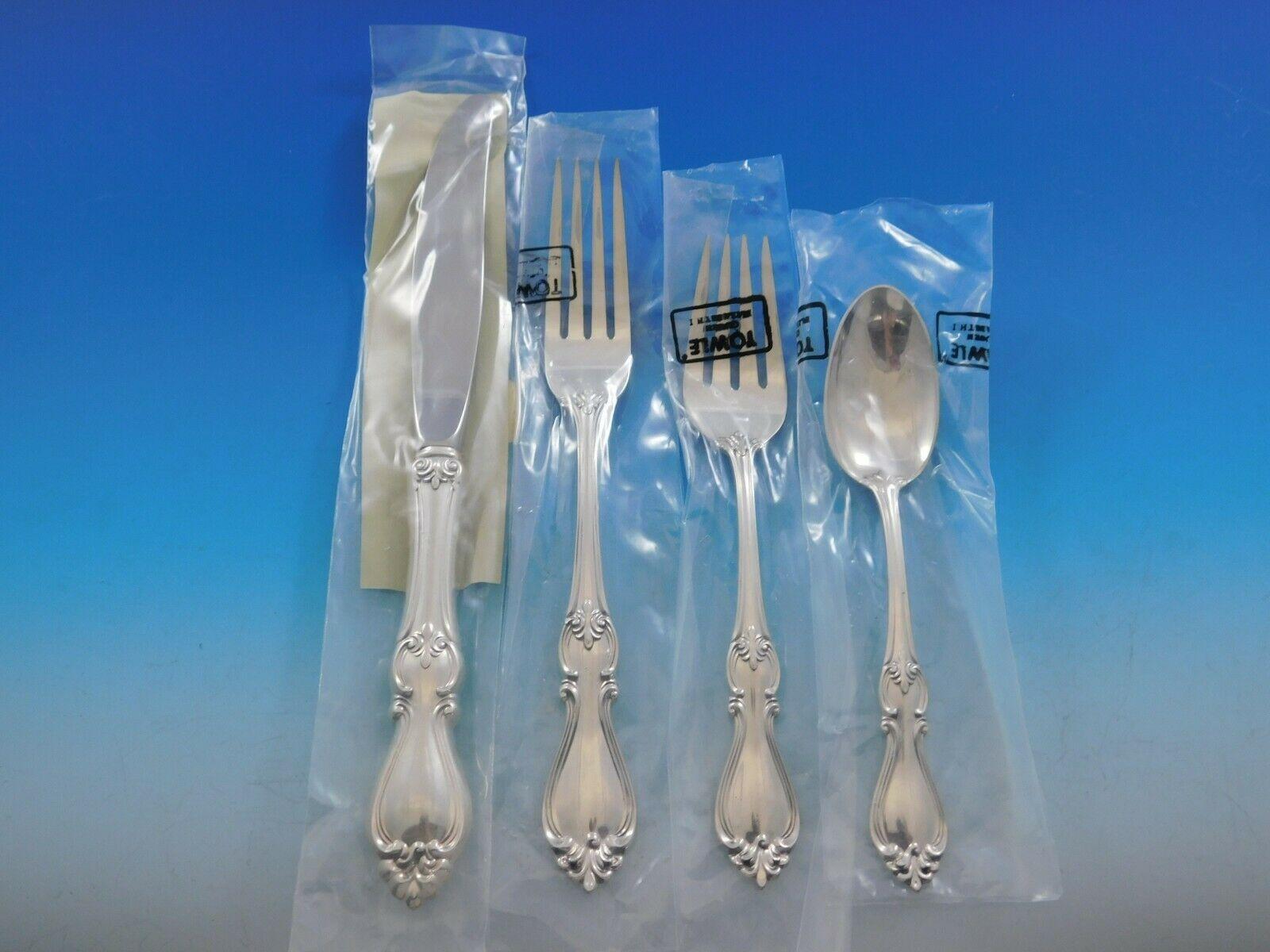 New, unused Queen Elizabeth I by Towle sterling silver flatware set, 54 pieces. This set includes:

12 place knives, 9