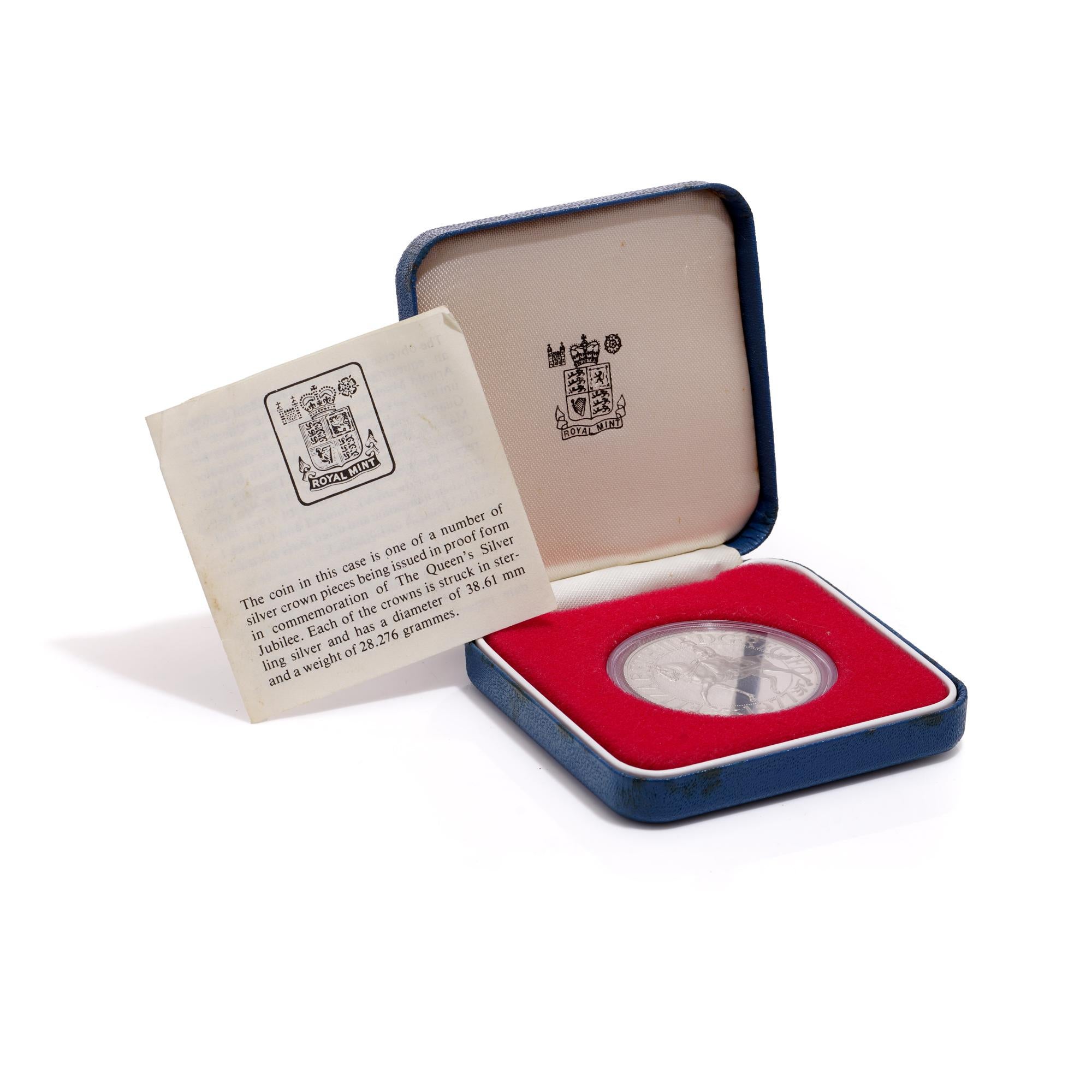 The coin in this case is one of a number of silver crown pieces being issued in proof form in commemoration of The Queen's Silver Jubilee.
Each of the crowns is struck in sterling silver and has a diameter of 38.61 mm and a weight of 28.276 grammes.