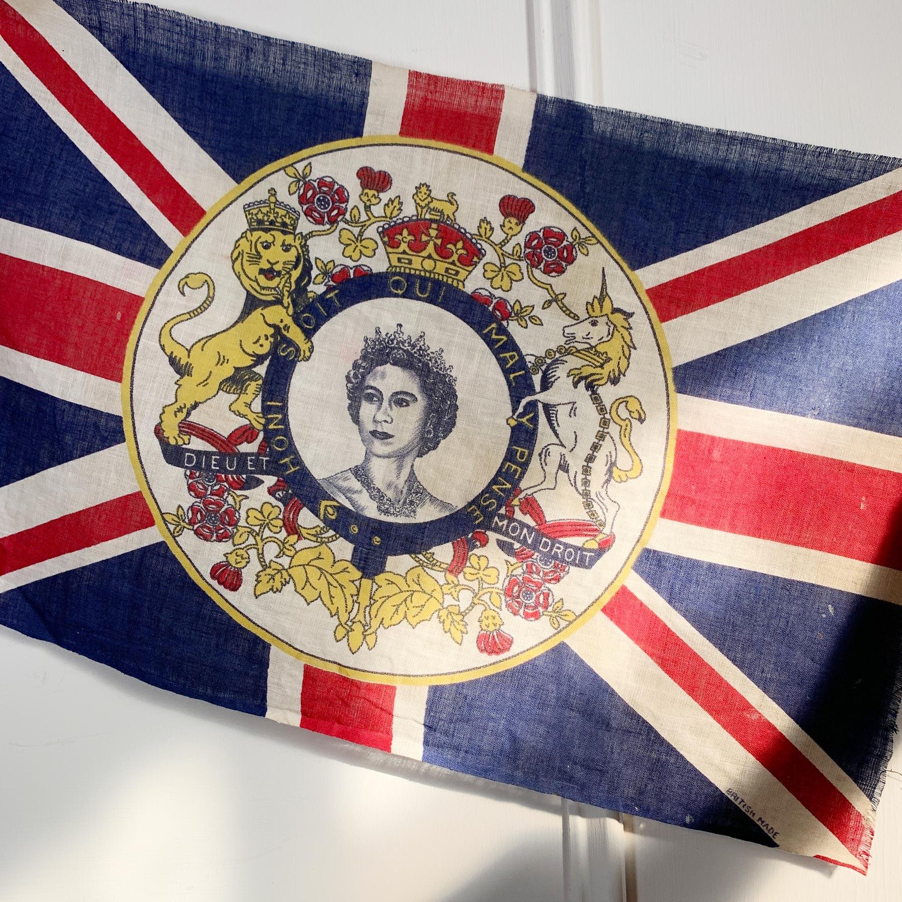 British Royal Family

A Rare And Historical Queen Elizabeth II Flag Union Jack Order of the Garter HONI SOIT MAL Y PENSE from the 1950's.

The Flag is made of Natural Cotton And British Made

The Flag Has 'British Made' Printed In The