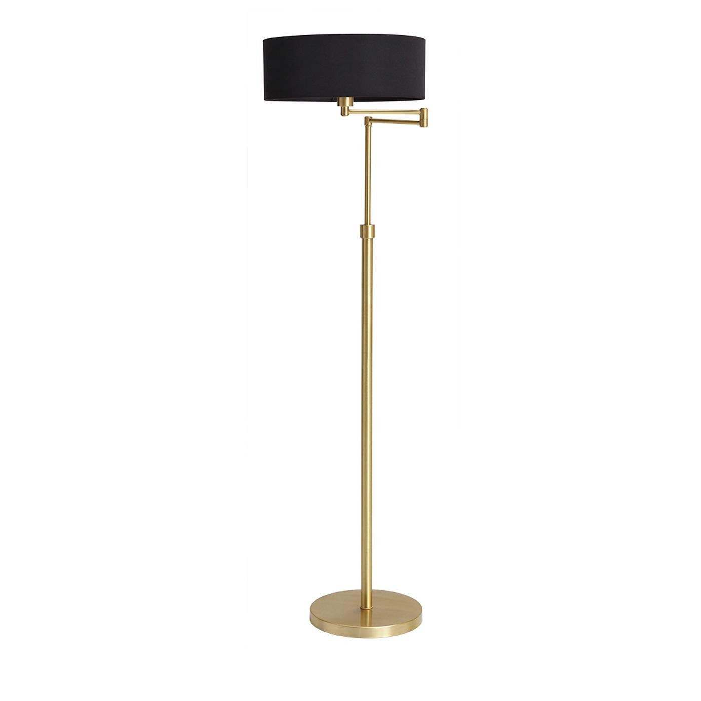 A timeless floor lamp for a chic, contemporary living room. The queen floor lamp stands on a simple brass base with a satin finish. With two hinges and an adjustable height, the lamp is perfect for reading the evening paper or relaxing with a good