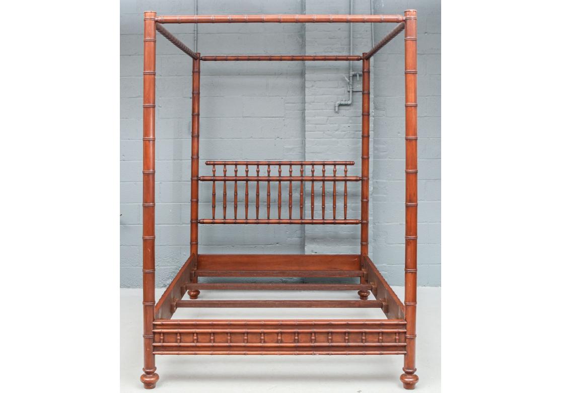 A queen size canopy bed with spindle back, the posts with ringed bamboo form, the side rails and foot board with carved bamboo motifs, resting on ringed feet. A fabulous bed with the allure of the Far East.
Dimensions: 90