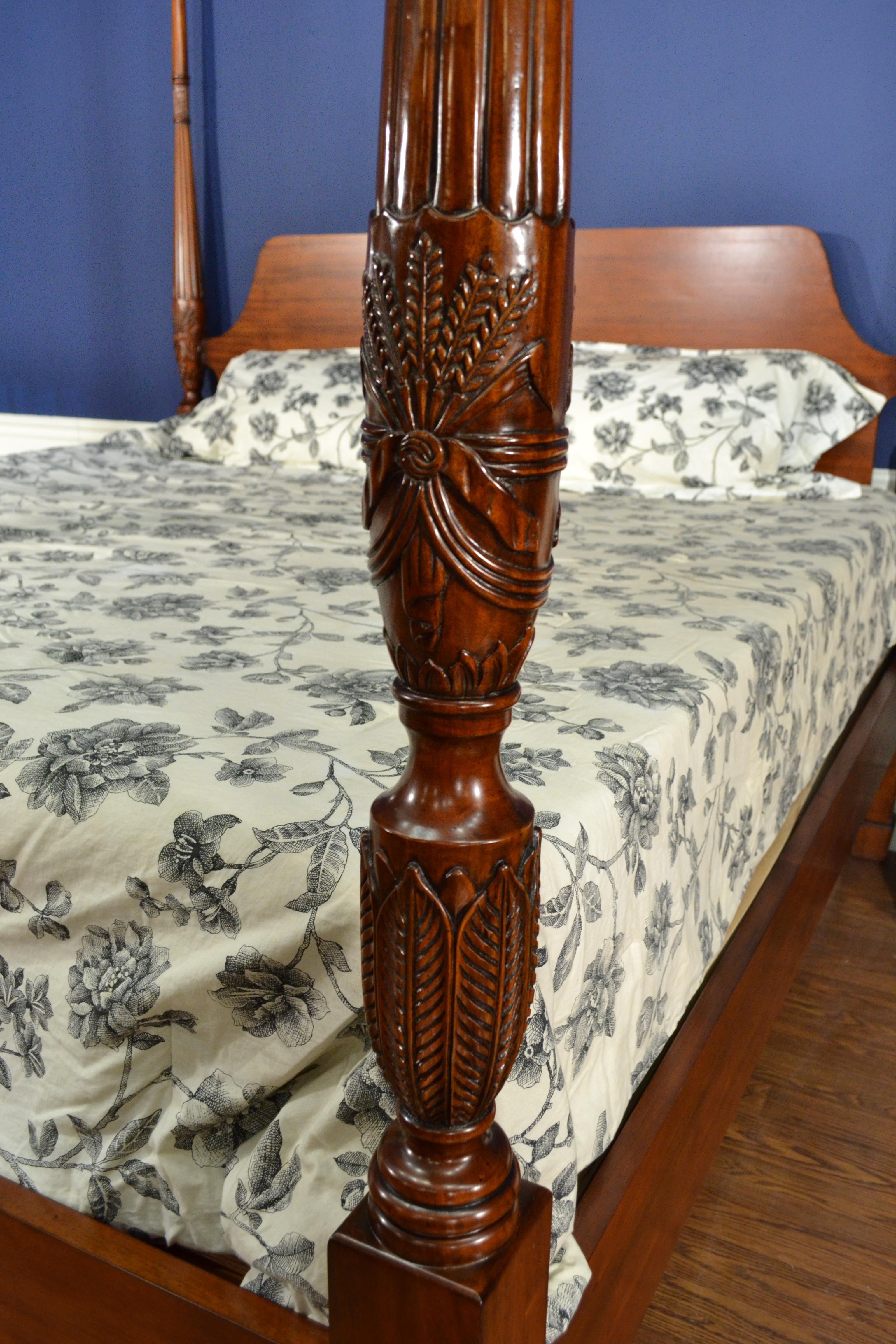 This is a new traditional queen size mahogany rice carved poster bed by Leighton Hall Furniture. It’s design was inspired by poster beds from the Regency period and features handmade rice carved posts which are fluted and tapered and a straight