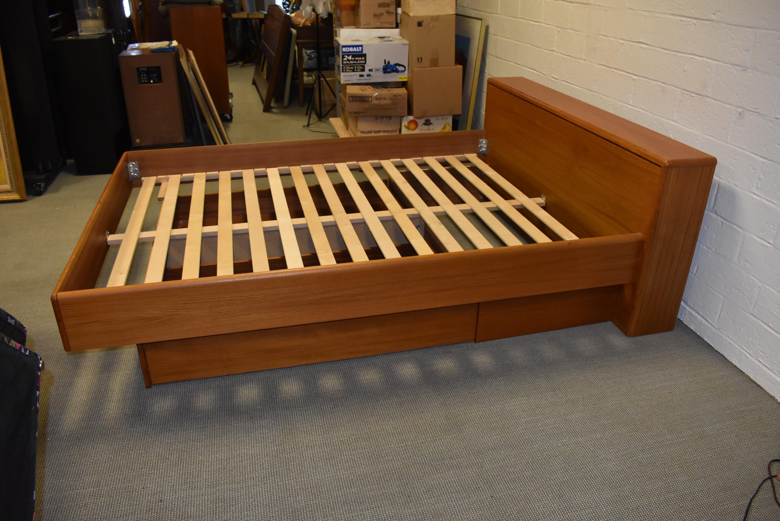 This queen teak platform bed is complete with large under drawers for storage. The headboard is hinged for extra storage as well. The bed overall measures 65.5