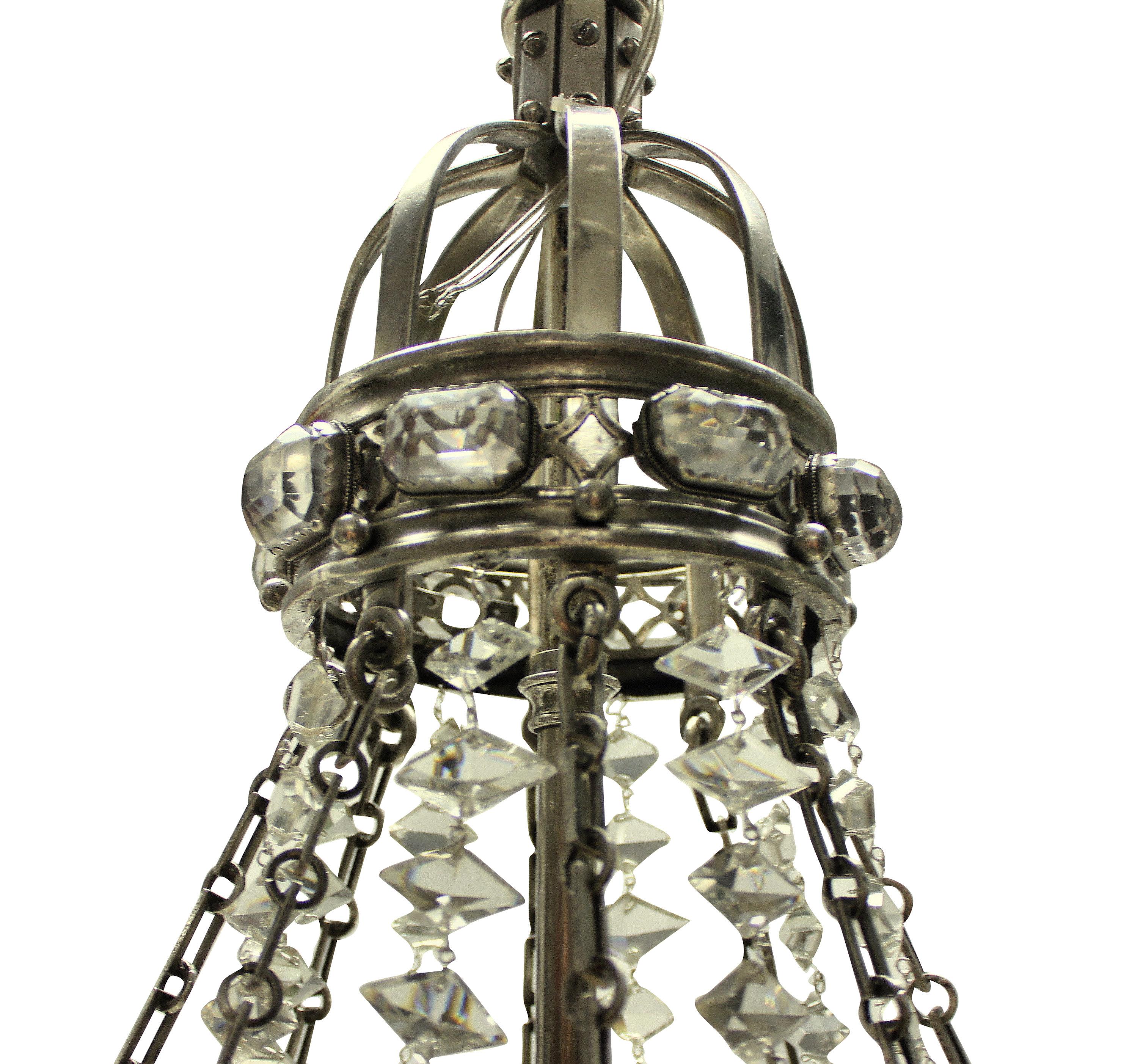 A rare and unusual English silver plated chandelier, made to celebrate the Diamond Jubilee of Queen Empress Victoria. The chandelier is fashioned to resemble elements of both her diadem and crown. The cut glass of good quality with bands of glass
