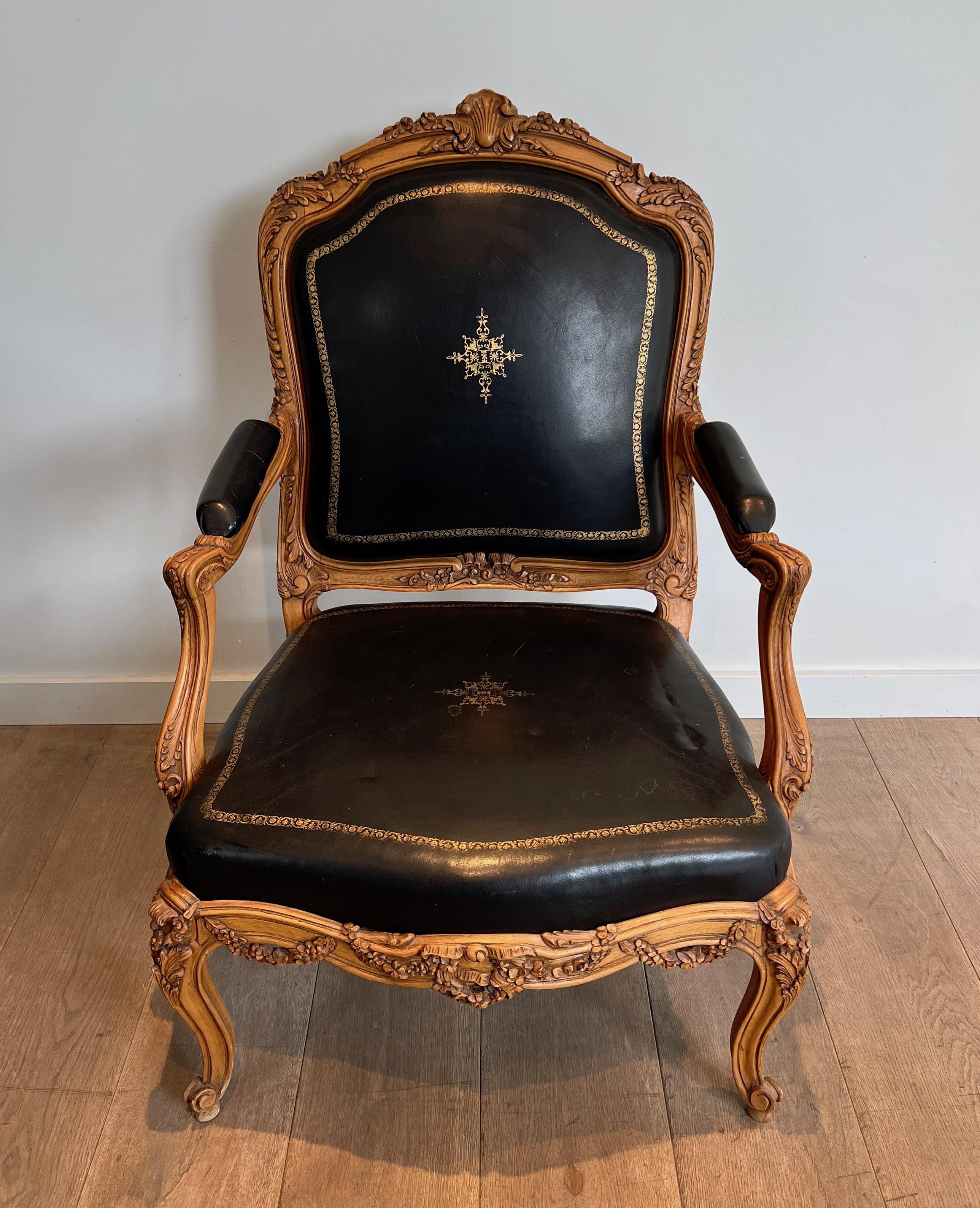 Rococo Queen's Armchair made of Carved Walnut Upholstered in Black Leather with Iron-Gi For Sale
