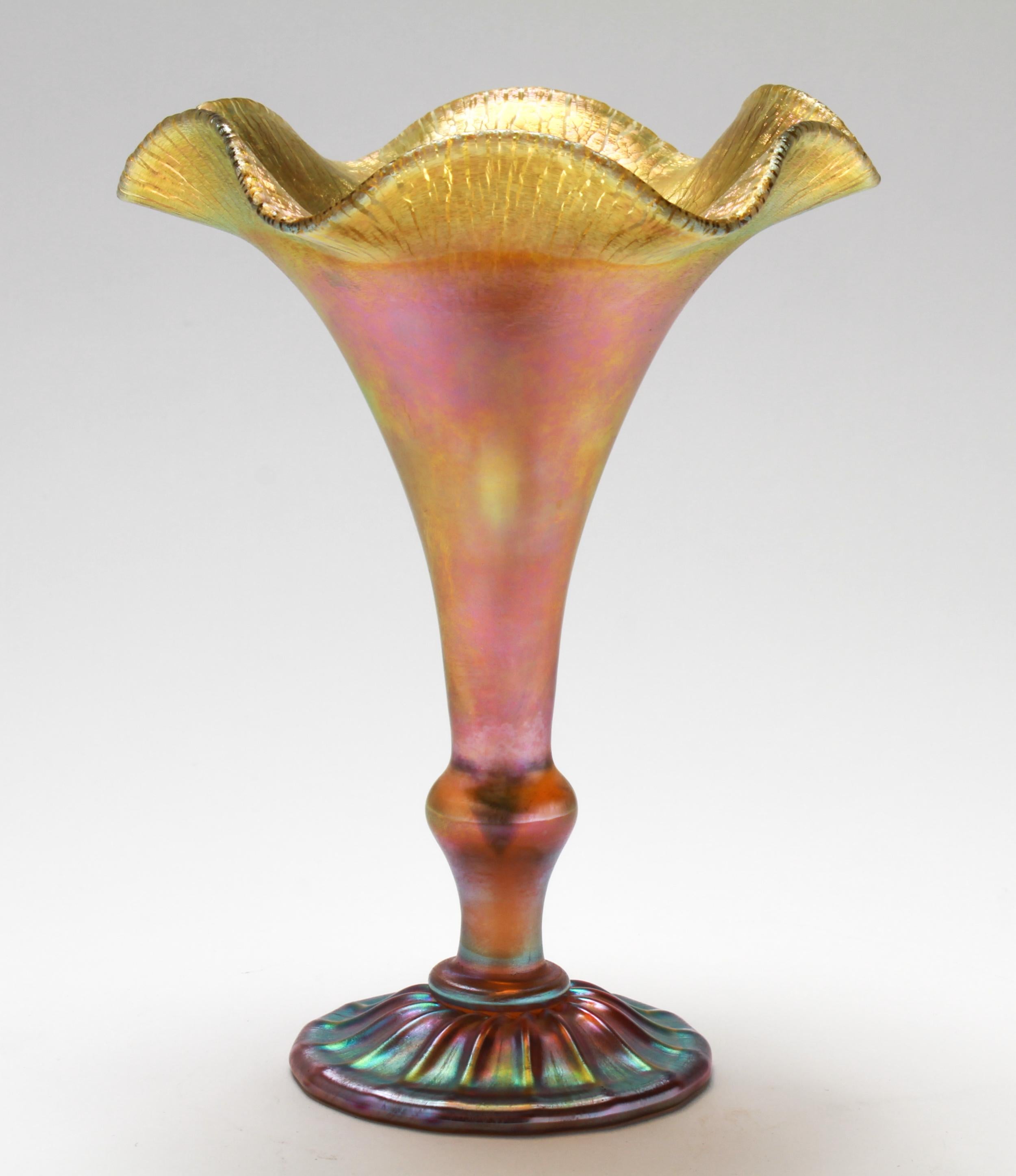 Quezal gold iridescent favrile art glass ruffled trumpet vase, bearing an etched signature and marking on the bottom: 