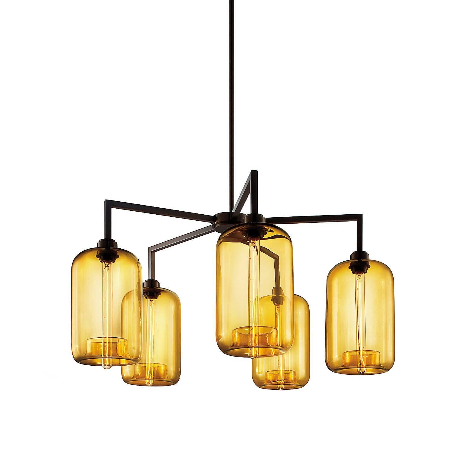 The refined frame of the quill chandelier accentuates the handcrafted silhouettes suspended from its bold body. With several signature glass and metal finish options available, the wide range of configurations offered in this collection enables the