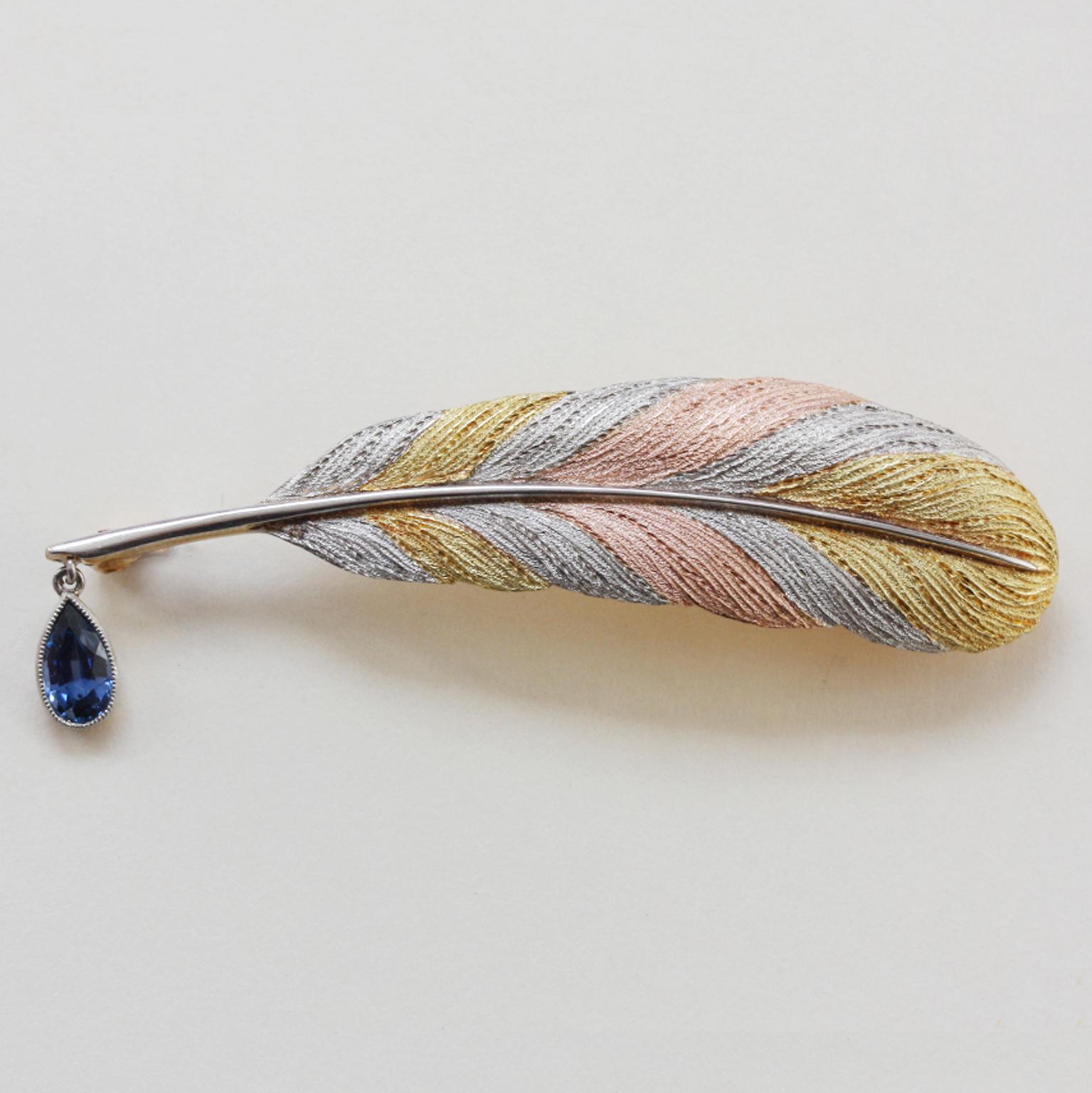A brooch representing a quill pen. At the tip of quill is a sapphire drop mounted in platinum – an ink drop or…. a tear drop (app. 0.45 ct.). The feather is made of platinum, pink and yellow gold, engraved on 15-carat gold. England, circa 1900, in