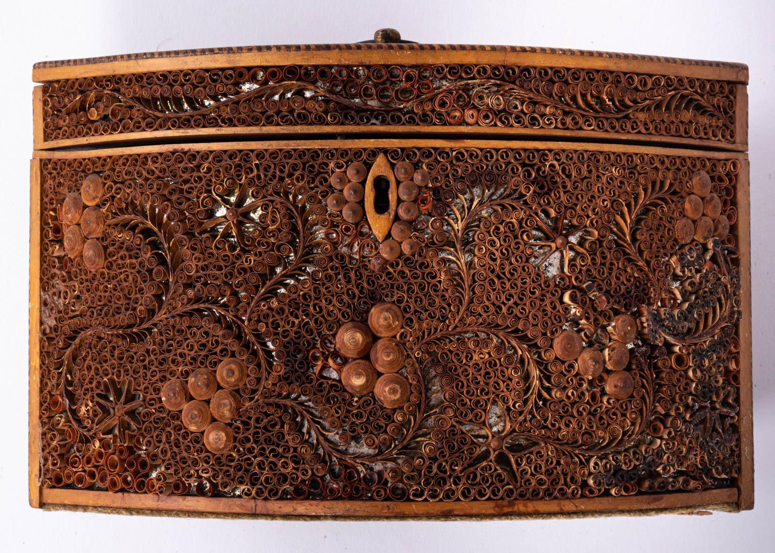 Pointed coiled paper oval tea caddy, circa 1800. Made by a student named Mary Hammond from Miss Miles School. Artist-signed. Please note of wear consistent with age.