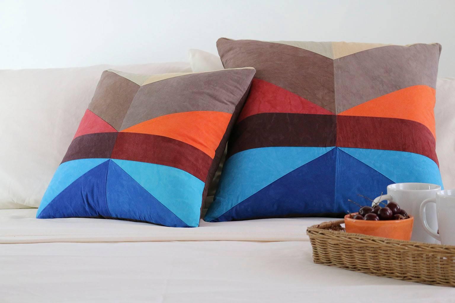 Vibrant New England colors in traditional American quilting patterns. 

With its distinct fabrics and careful, precise construction, each pillow is a stunning work of art. DUNN works closely with a fabric supplier and local quilter to craft these