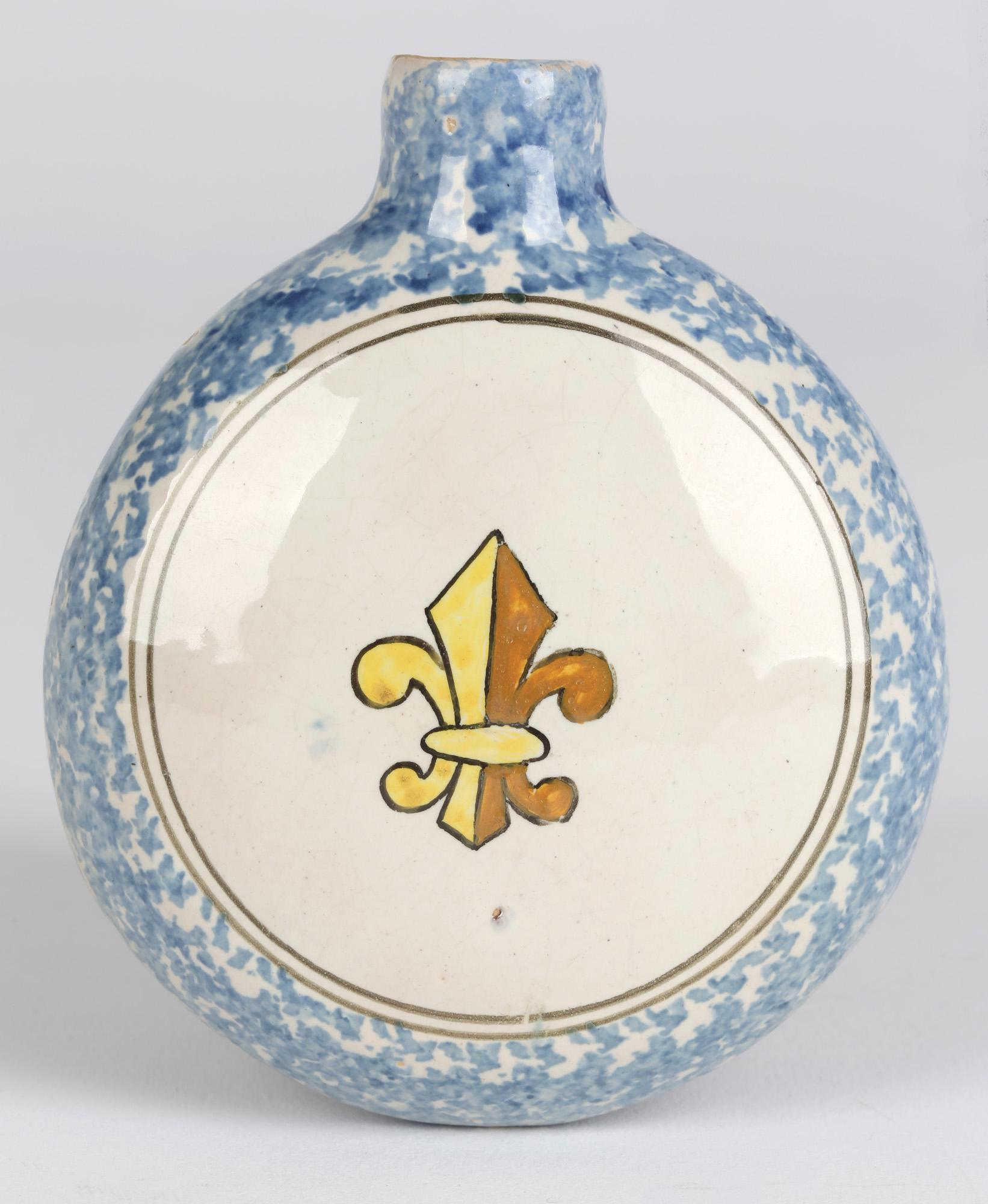 A stylish French faience pottery hand painted flask with a Breton figure by Quimper and dating from the latter 19th century. The small rounded flask has a funnel shaped neck with a small unglazed hole which would probably have had a fitted cork. The