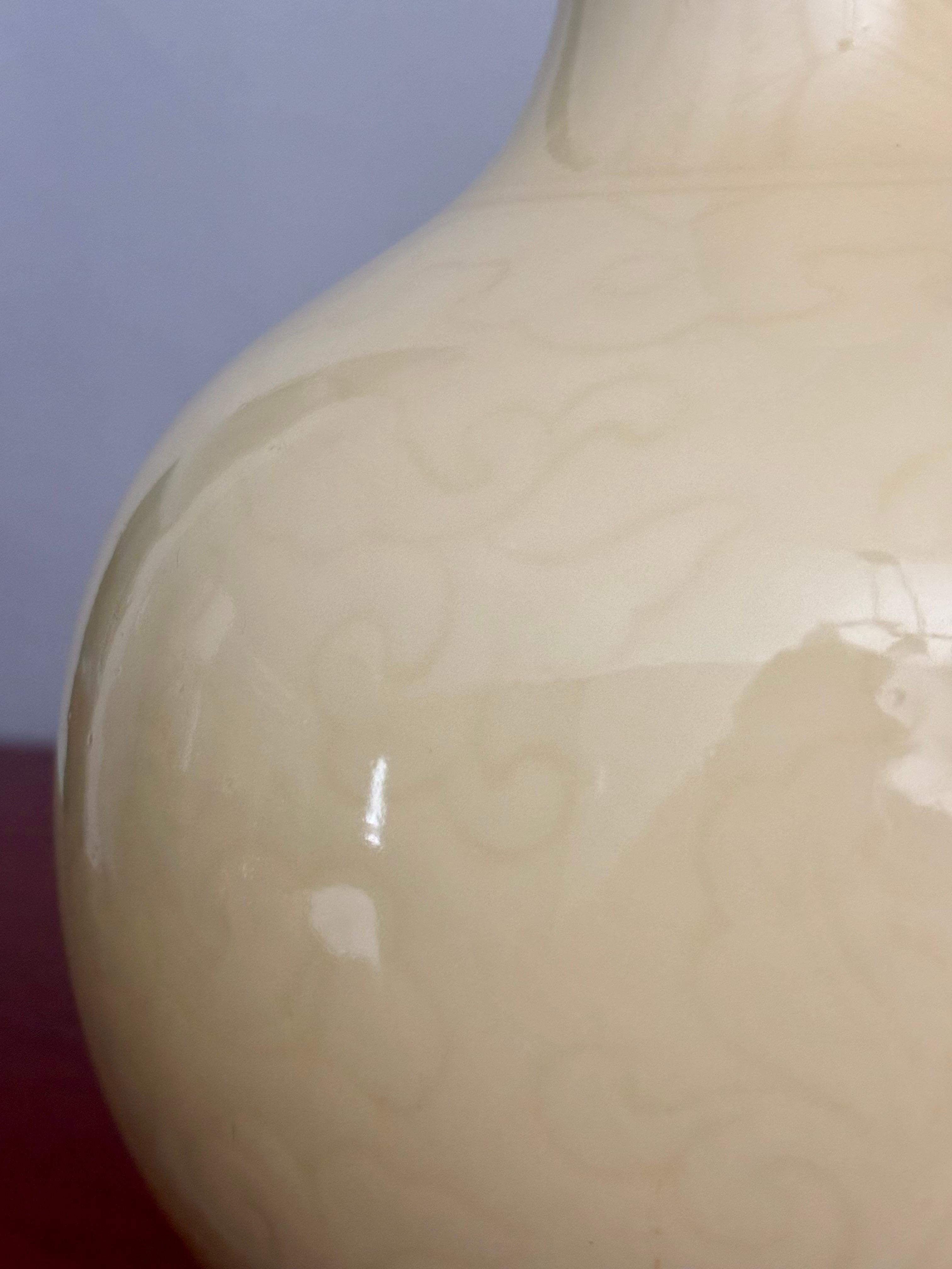 Pair of Fanille Jaune vases from turn of the century China. Either Quin Dynasty era or early Republic of China era. 

Done in a beautiful pale yellow with hidden incesed yellow floral detail under the glaze that is visible only in certain light.