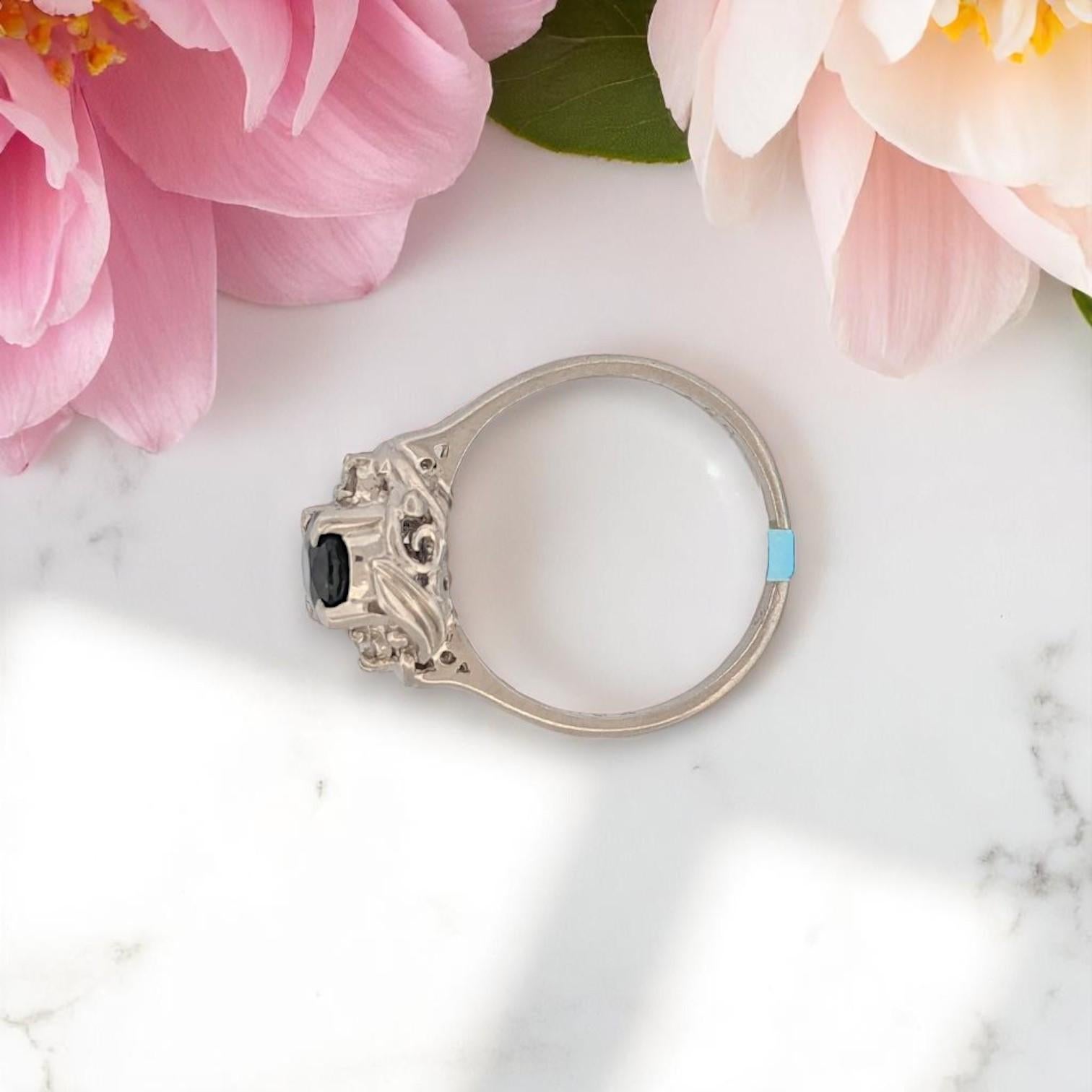 Classic beauty, redefined in platinum. The Quincy Ring by Mountain Song Jeweler exudes regal charm and timeless elegance. Centered by a stunning 1 carat natural oval sapphire — deep, velvety blue with mesmerizing depth — and framed by .40 carat