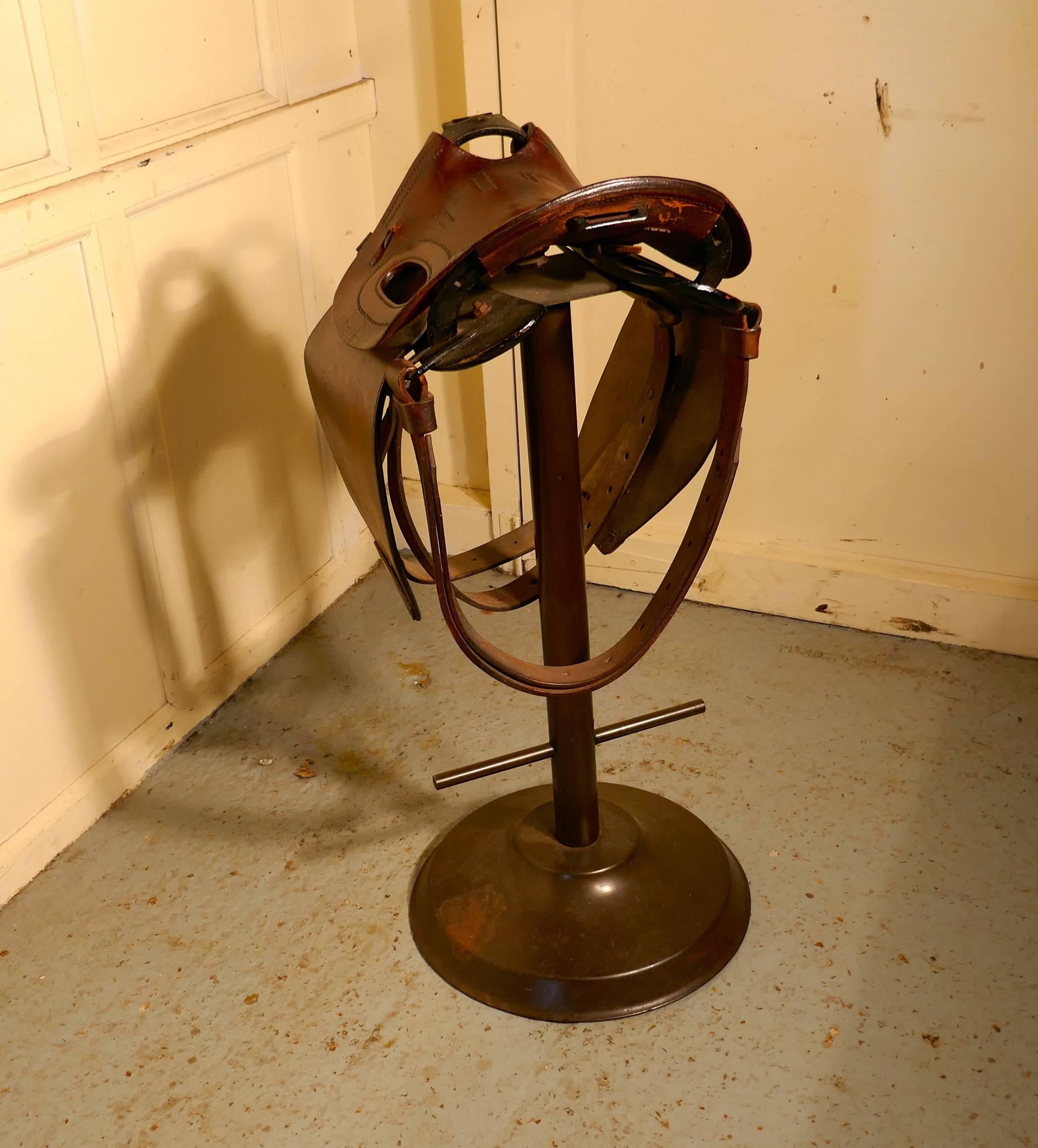 Quirky high bar stool, horse saddle bar stool

Quirky bar or kitchen stool an absolute must for the equestrian, this is a good solid Leather saddle that had been mounted on to a purpose made iron frame with foot rests. 
A superb high stool,