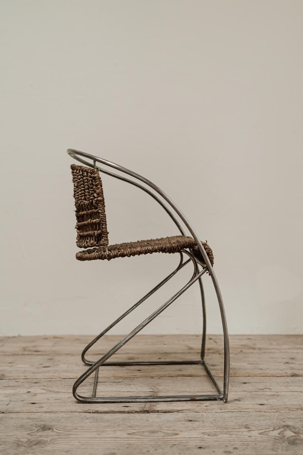 1970s quirky iron/rattan chair.