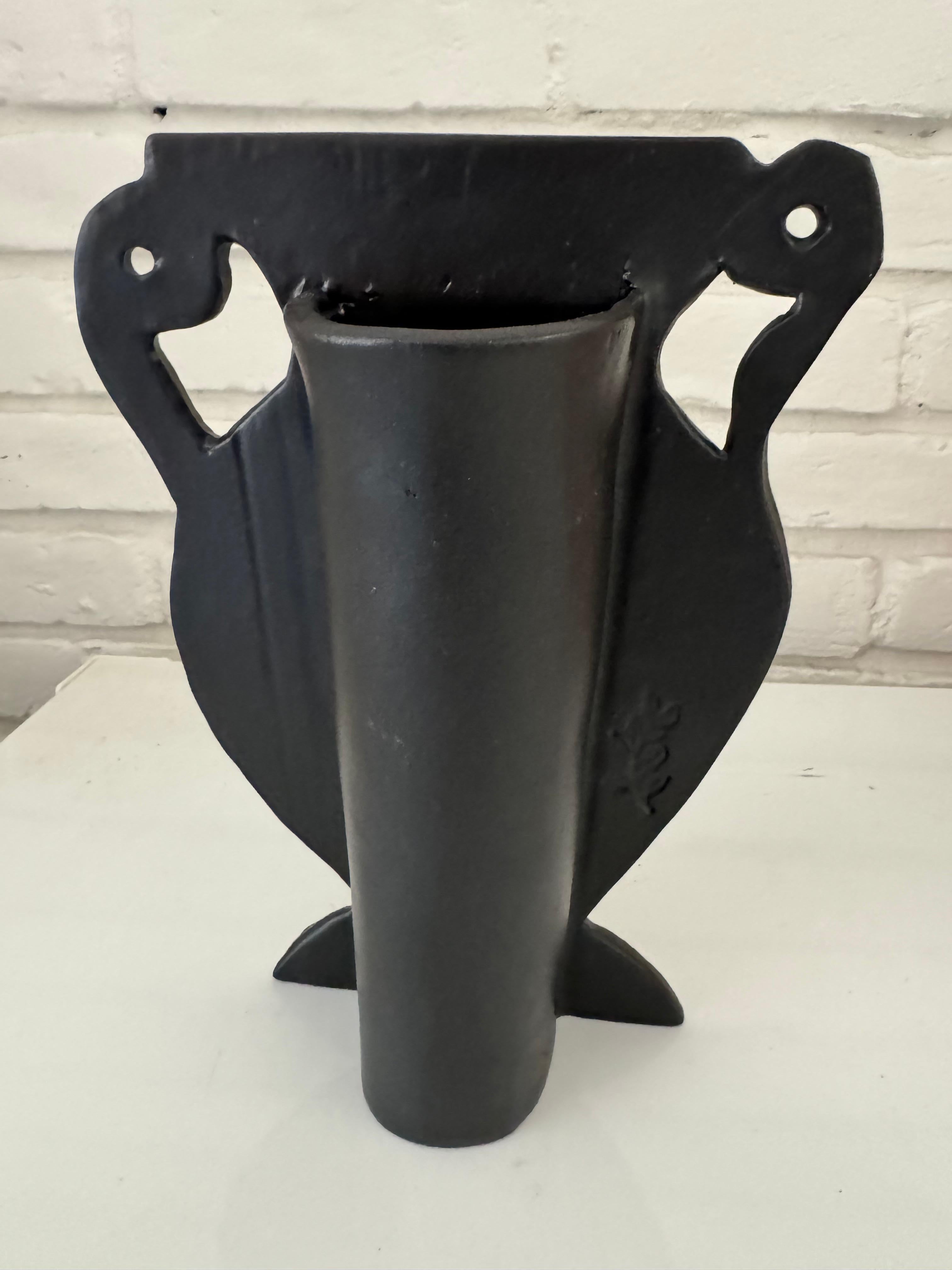 The quirkier , the better.....deliberately wonky brocade patterned matte black silhouette vase.